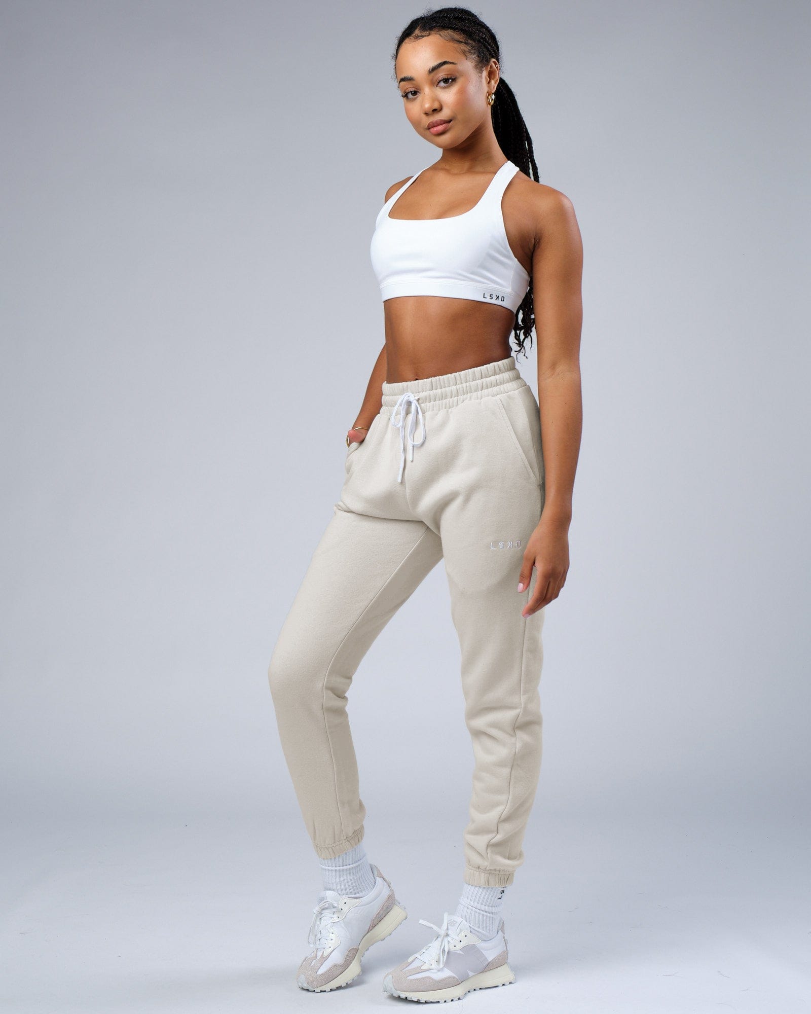 Model wearing Unisex Ready Track Pant - Bone