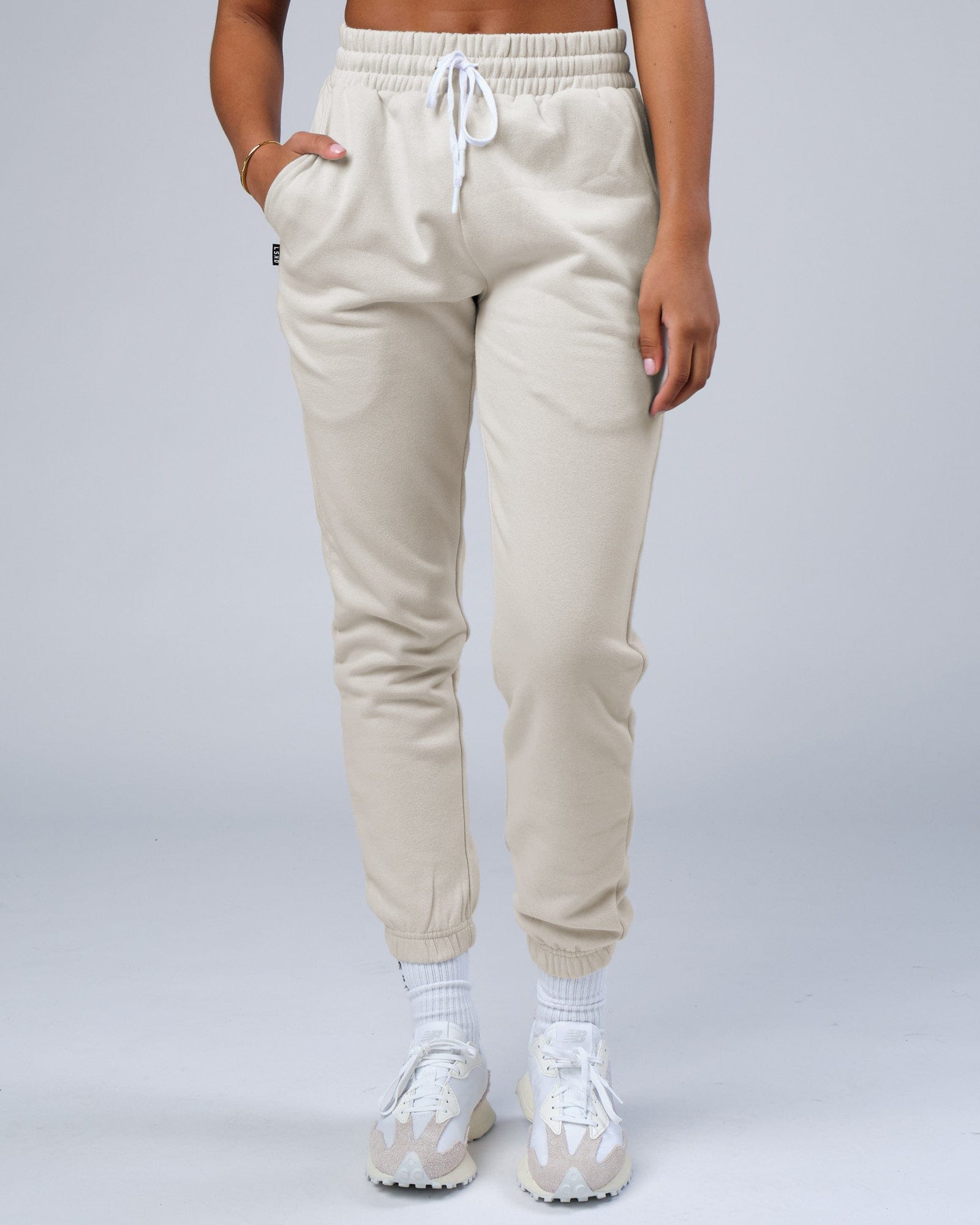 Model wearing Unisex Ready Track Pant - Bone