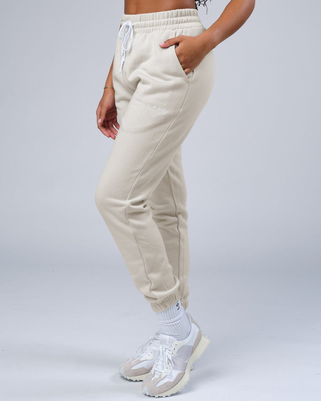 Model wearing Unisex Ready Track Pant - Bone