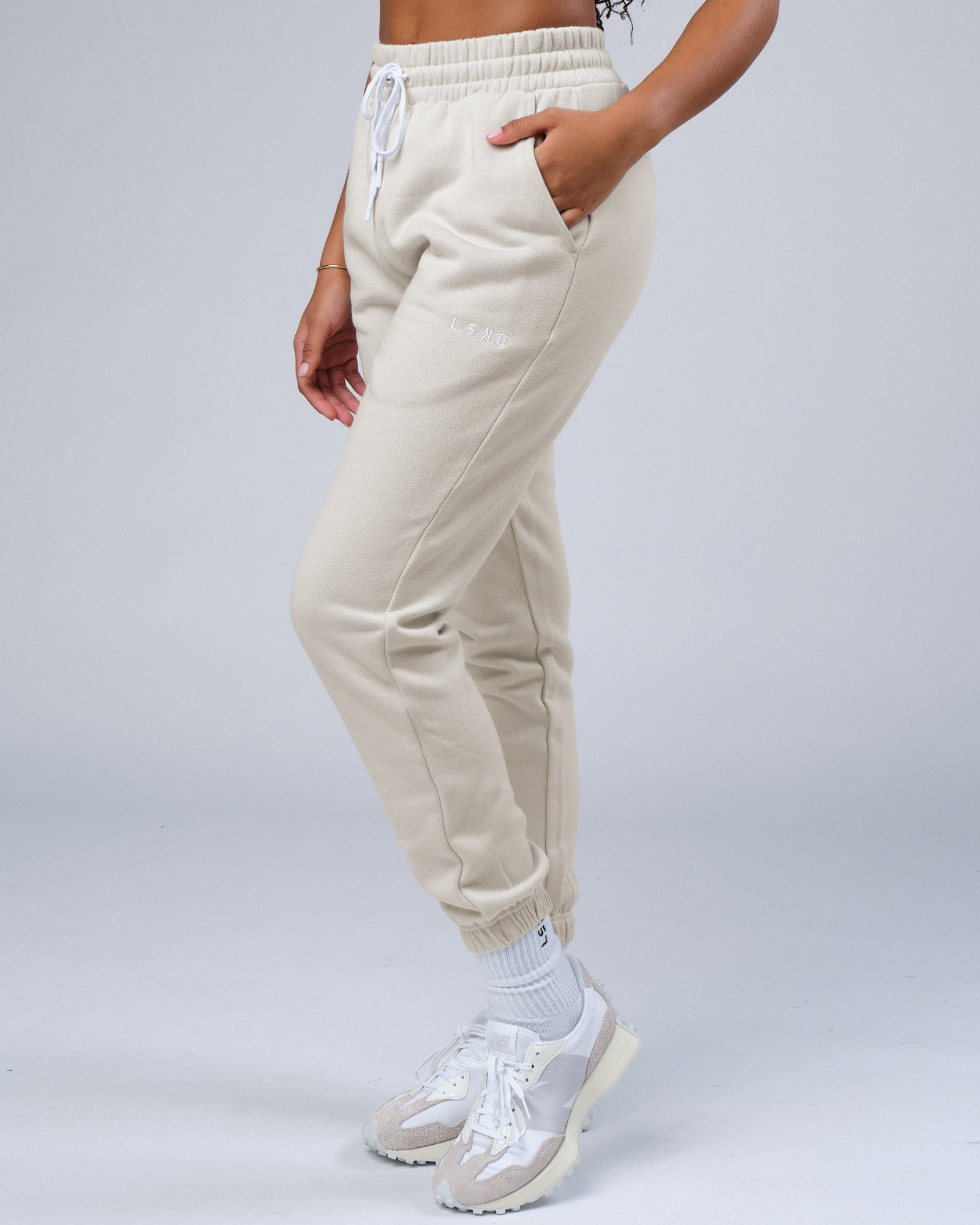 Model wearing Unisex Ready Track Pant - Bone
