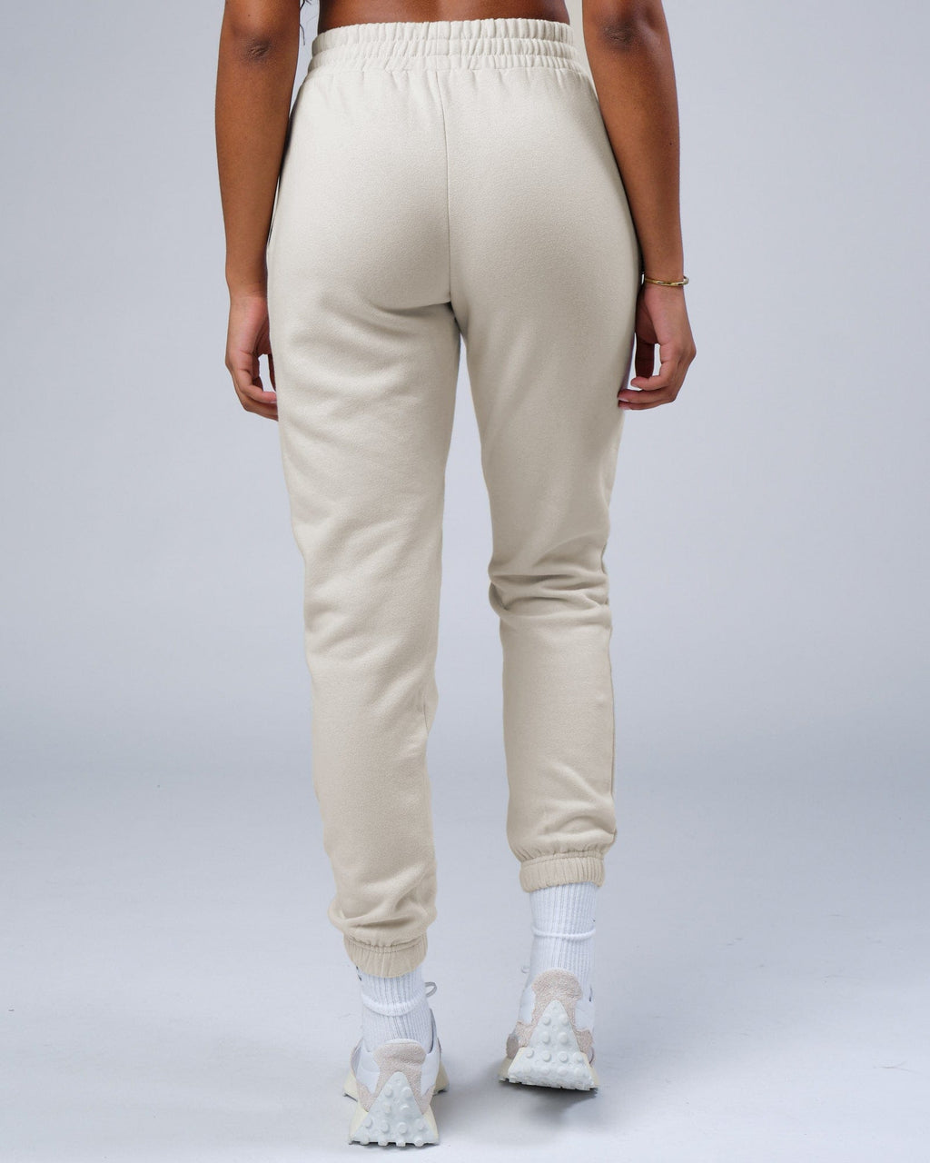 Model wearing Unisex Ready Track Pant - Bone