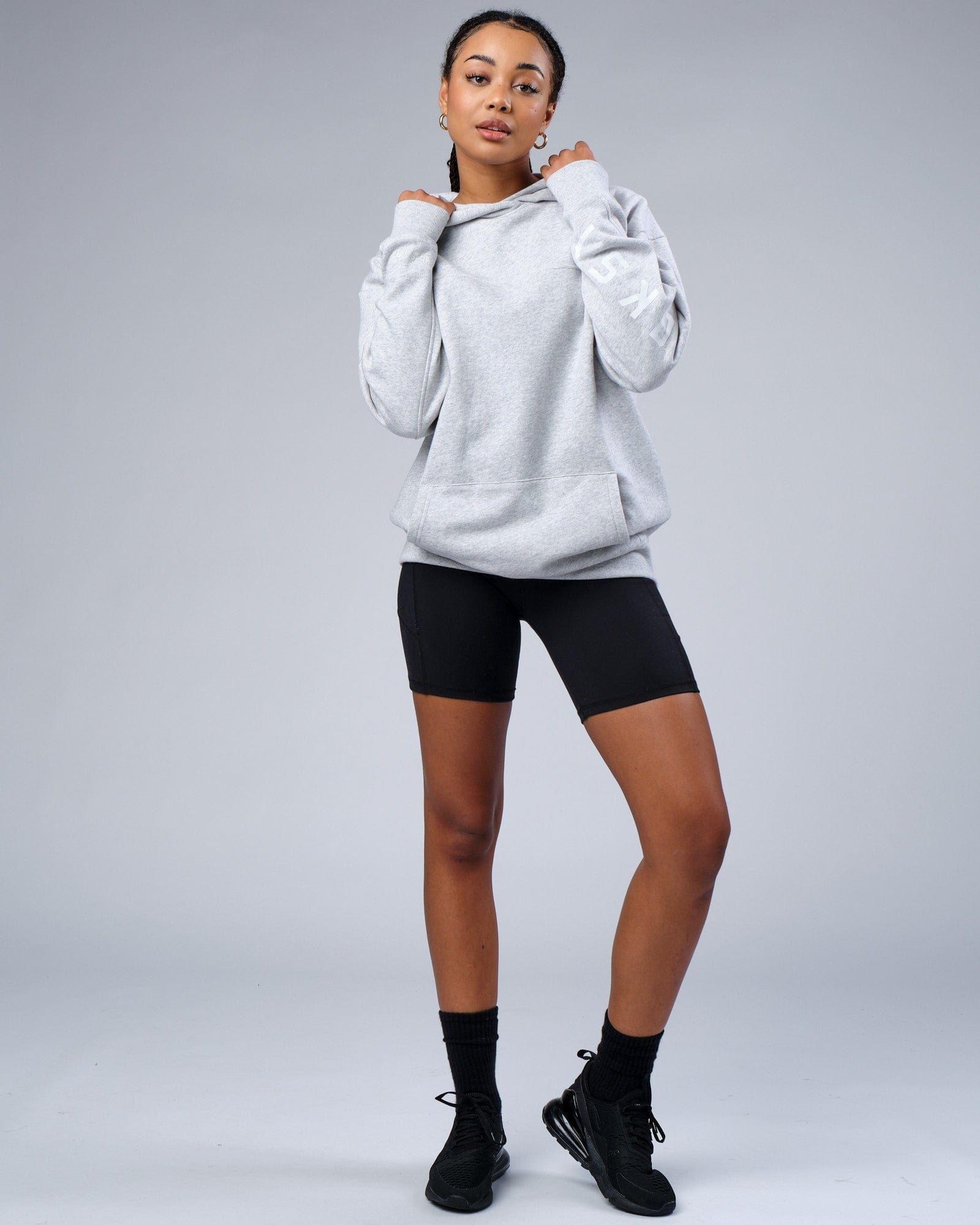 Model wearing Unisex Zone Hoodie Oversize - Lt Grey Marl