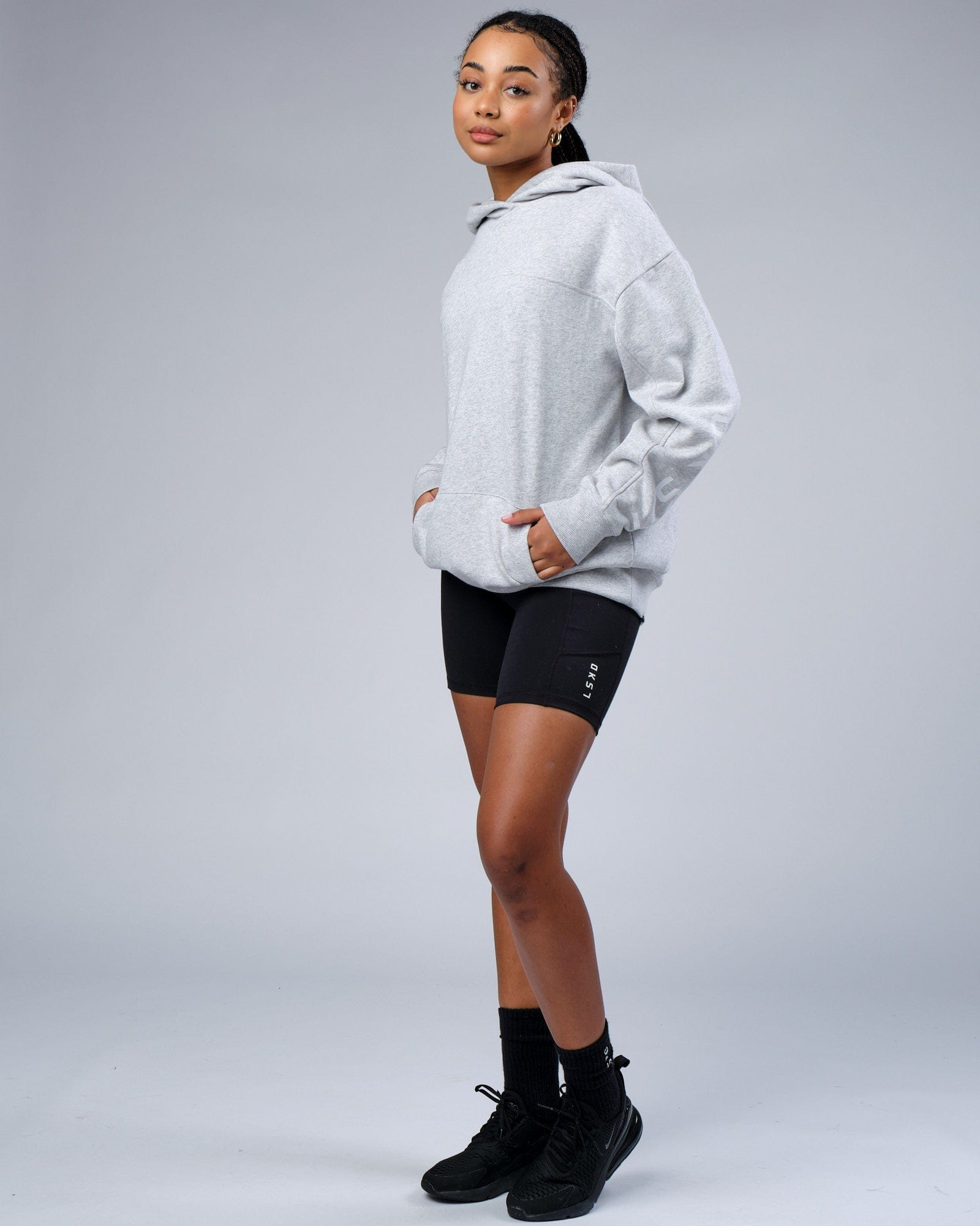 Model wearing Unisex Zone Hoodie Oversize - Lt Grey Marl