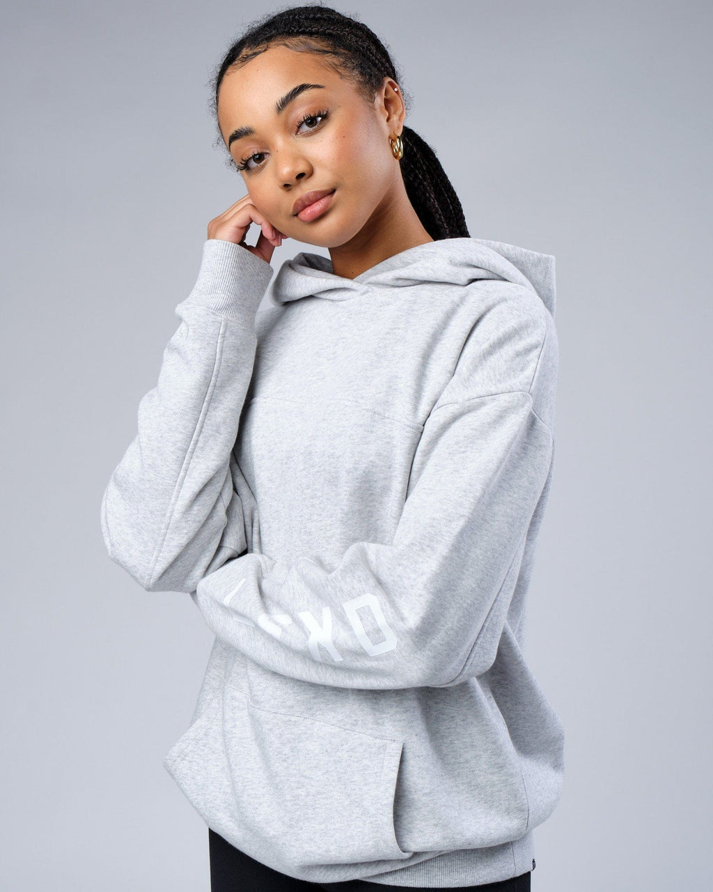 Model wearing Unisex Zone Hoodie Oversize - Lt Grey Marl