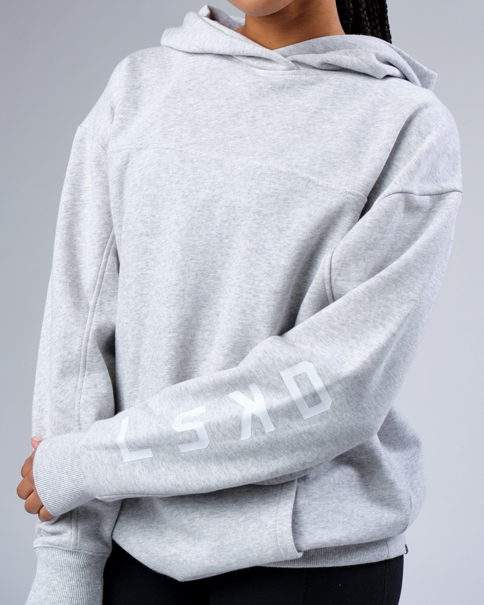 Model wearing Unisex Zone Hoodie Oversize - Lt Grey Marl