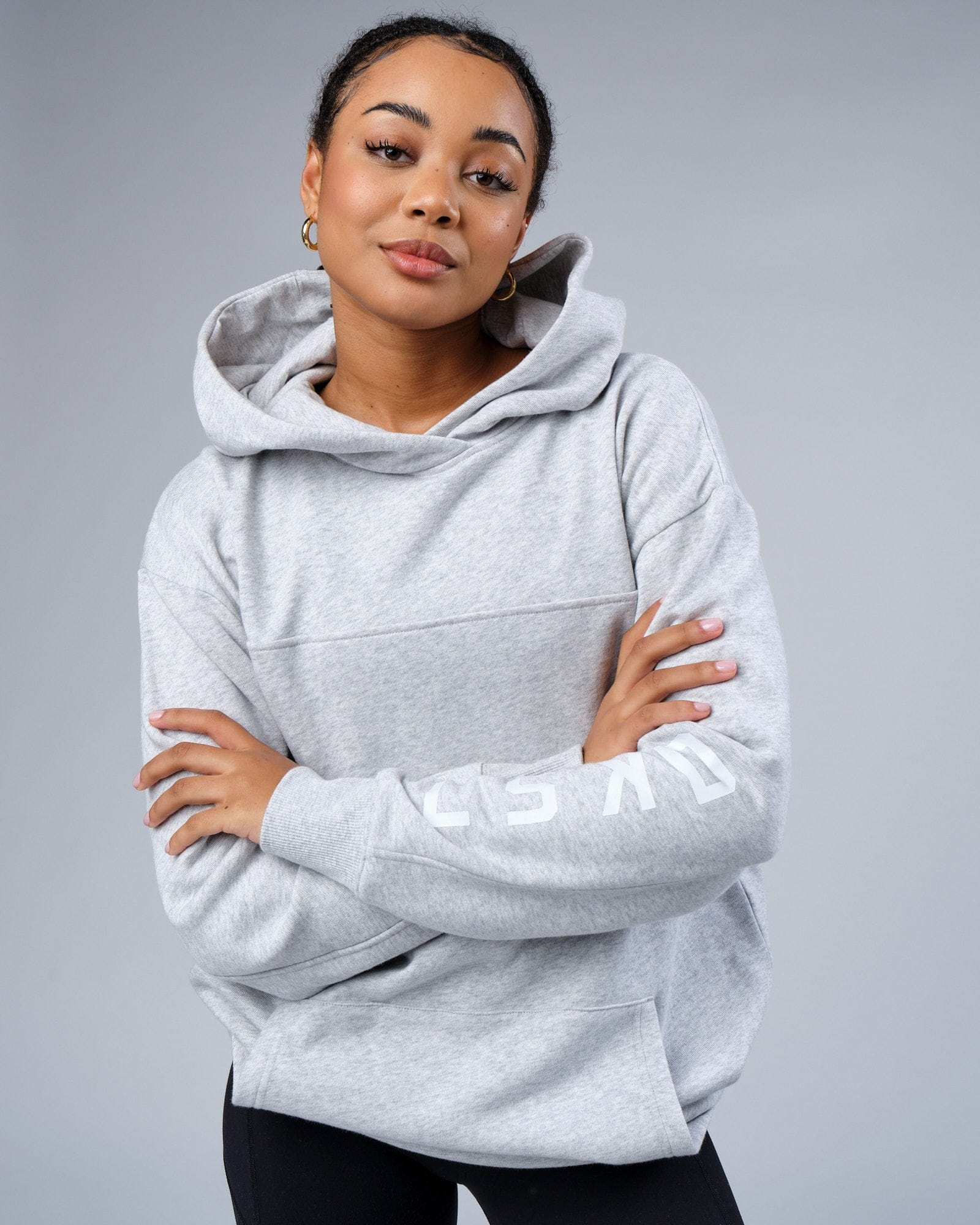 Model wearing Unisex Zone Hoodie Oversize - Lt Grey Marl