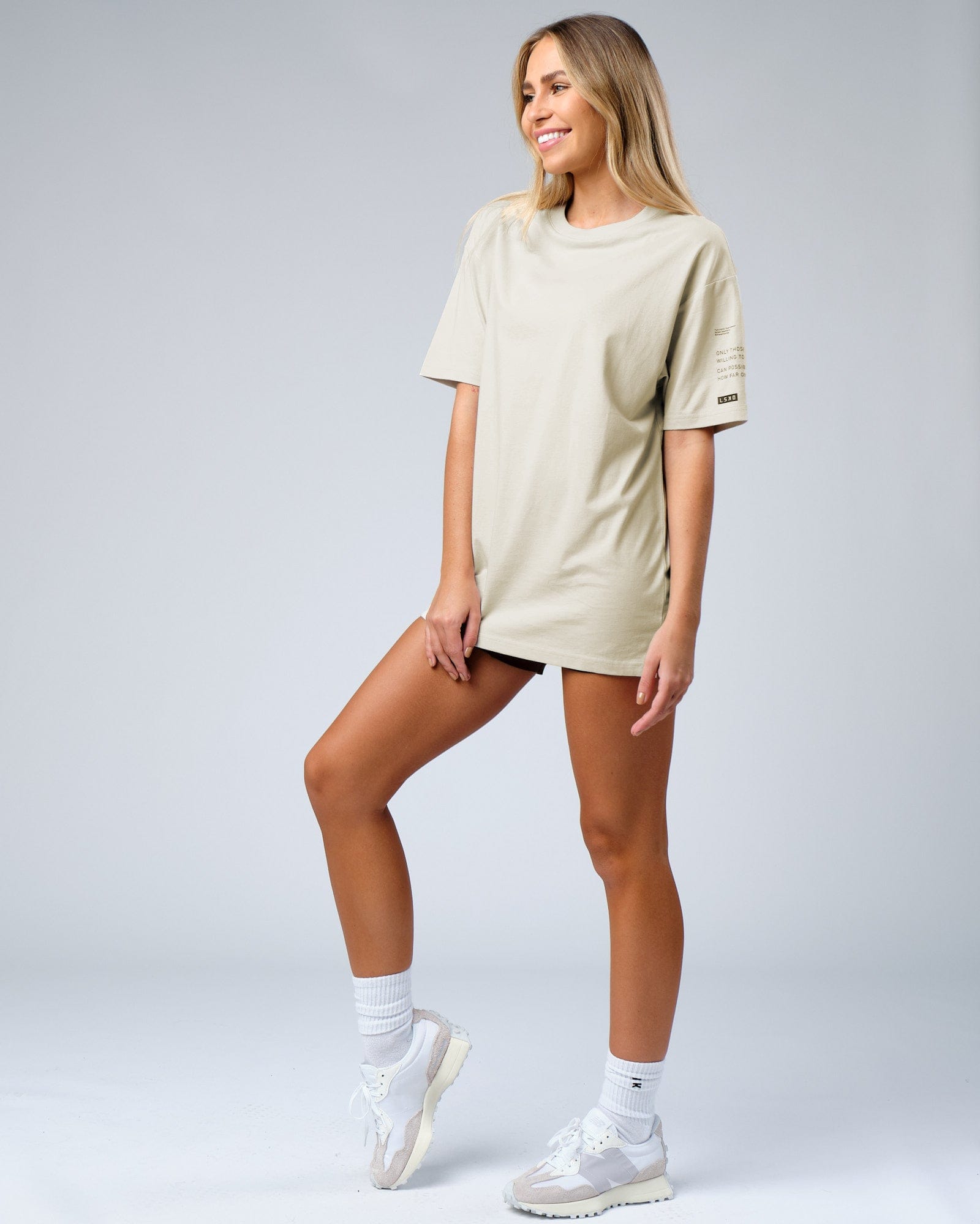 Model wearing Unisex Effort Tee Oversize - Bone