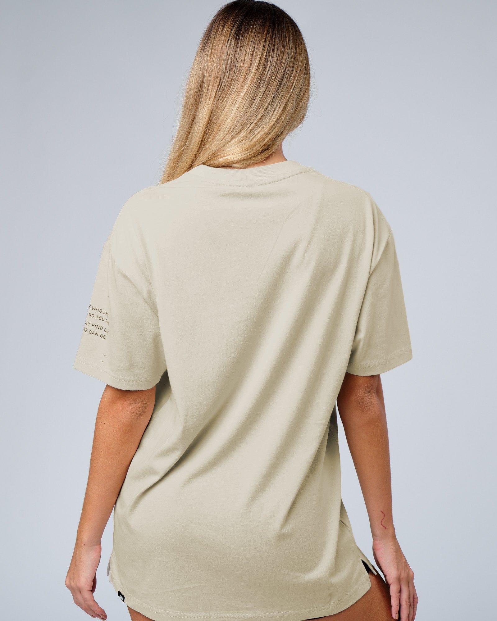 Model wearing Unisex Effort Tee Oversize - Bone