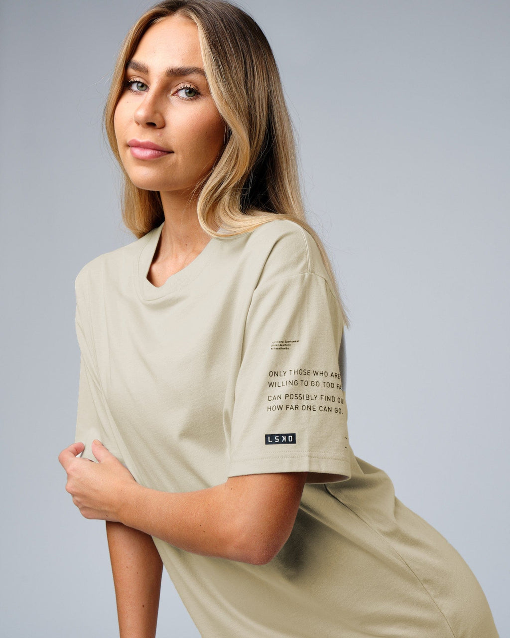 Model wearing Unisex Effort Tee Oversize - Bone