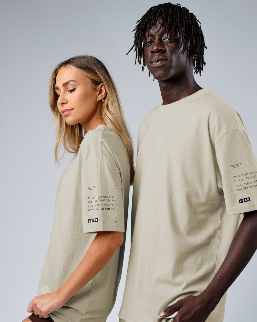 Model wearing Unisex Effort Tee Oversize - Bone