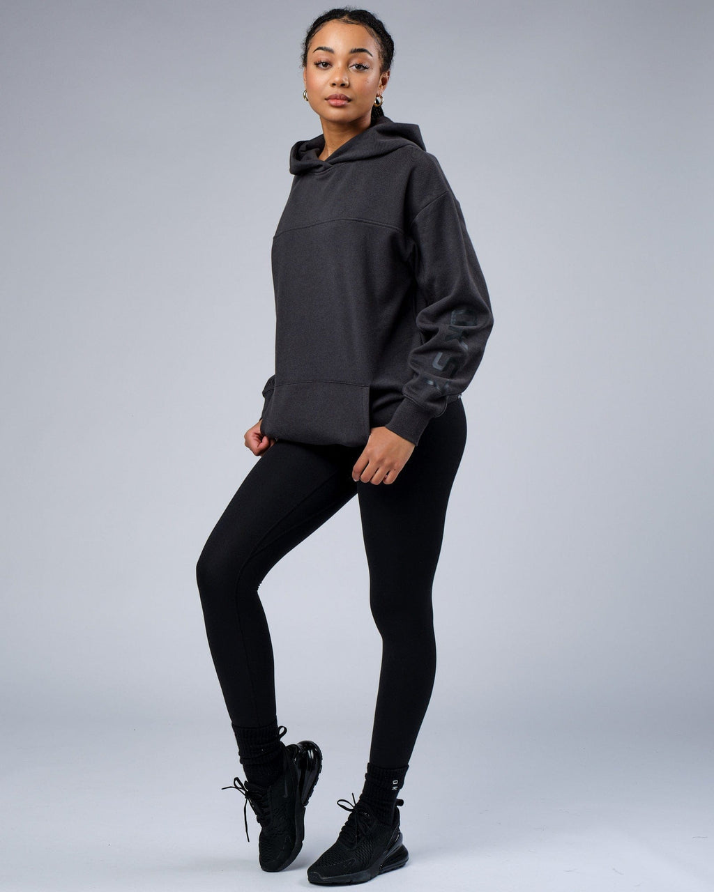 Model wearing Unisex Zone Hoodie Oversize - Phantom