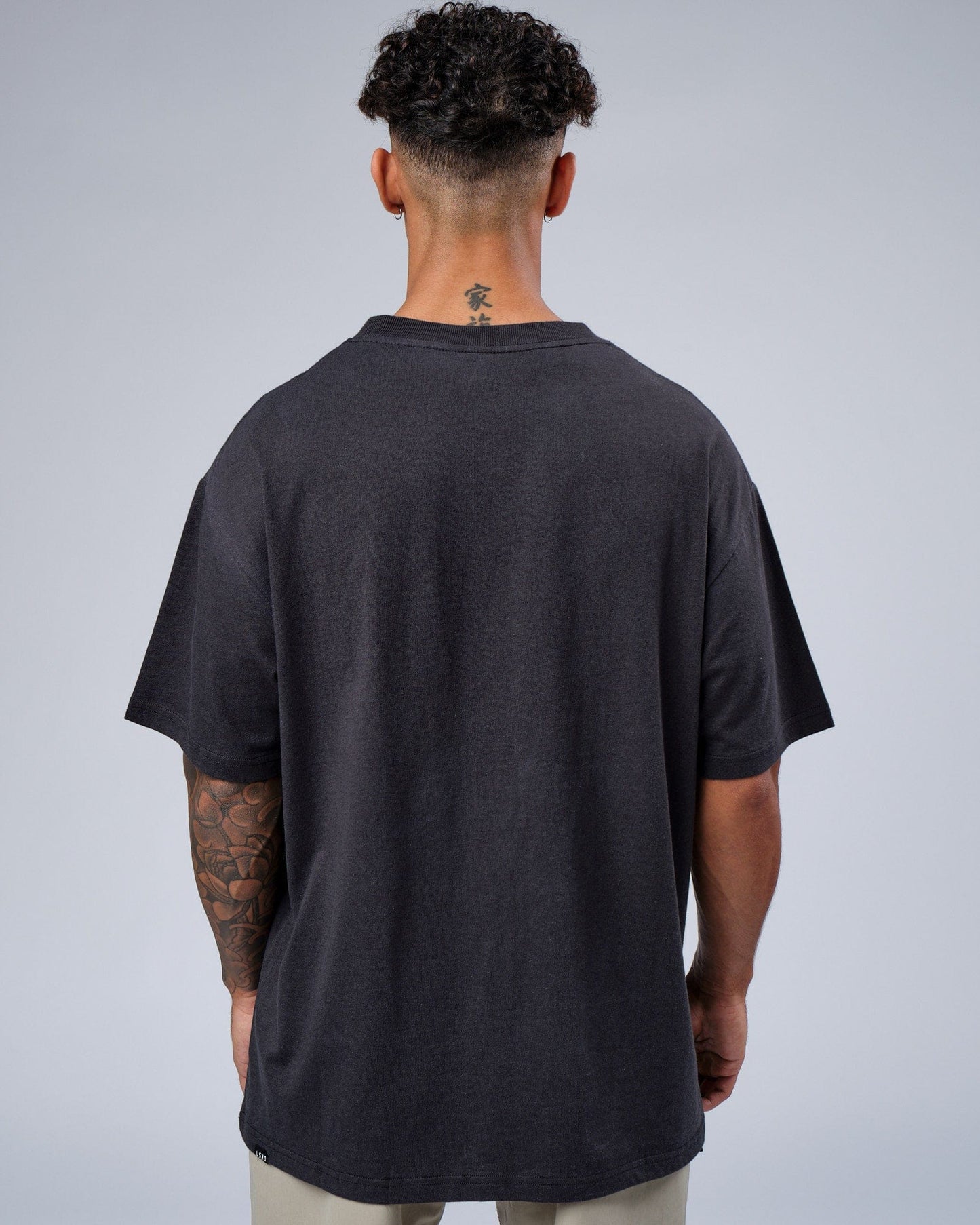 Model wearing Faculty Tee Vintage Fit - Phantom