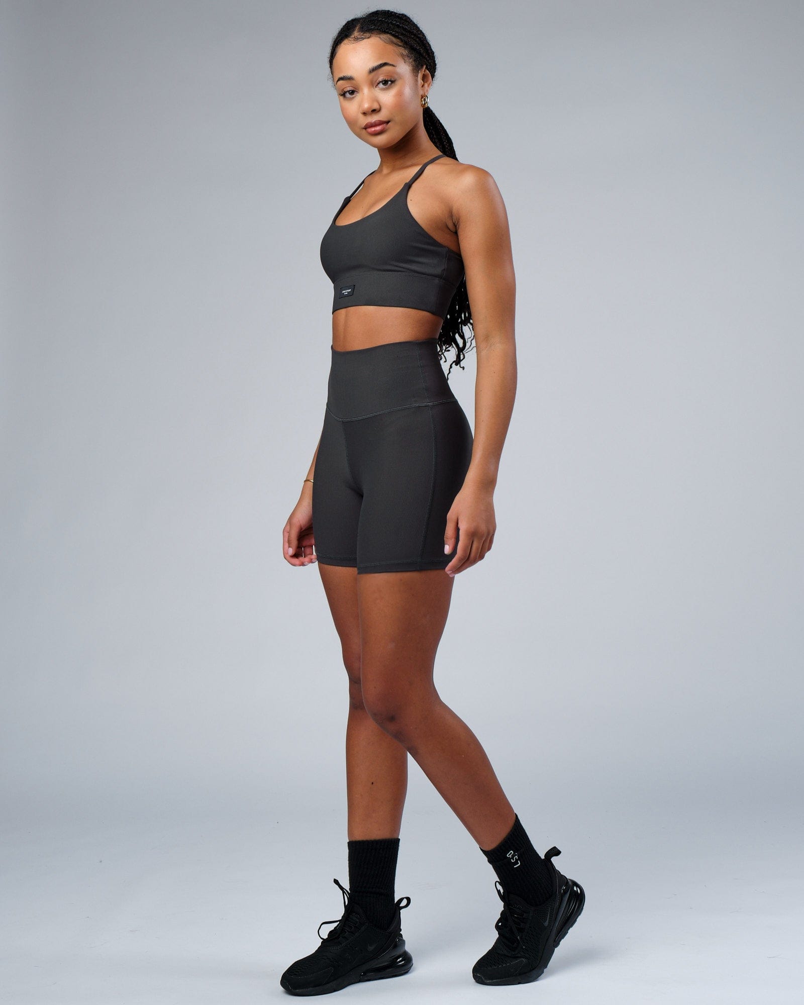 Model wearing Reserves Ribbed Mid Short Tight - Pirate Black