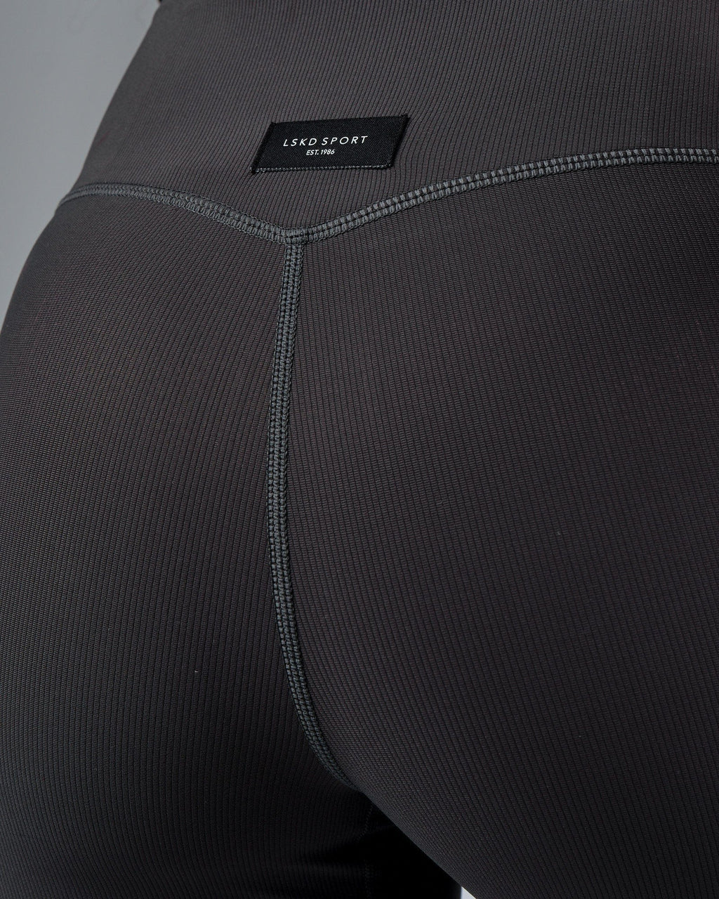 Model wearing Reserves Ribbed Mid Short Tight - Pirate Black