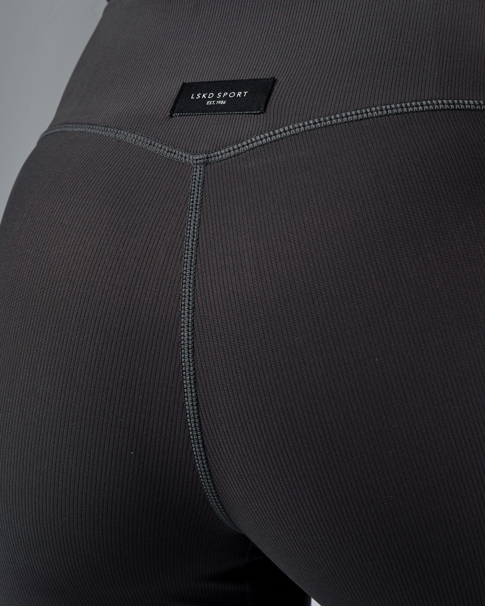 Model wearing Reserves Ribbed Mid Short Tight - Pirate Black