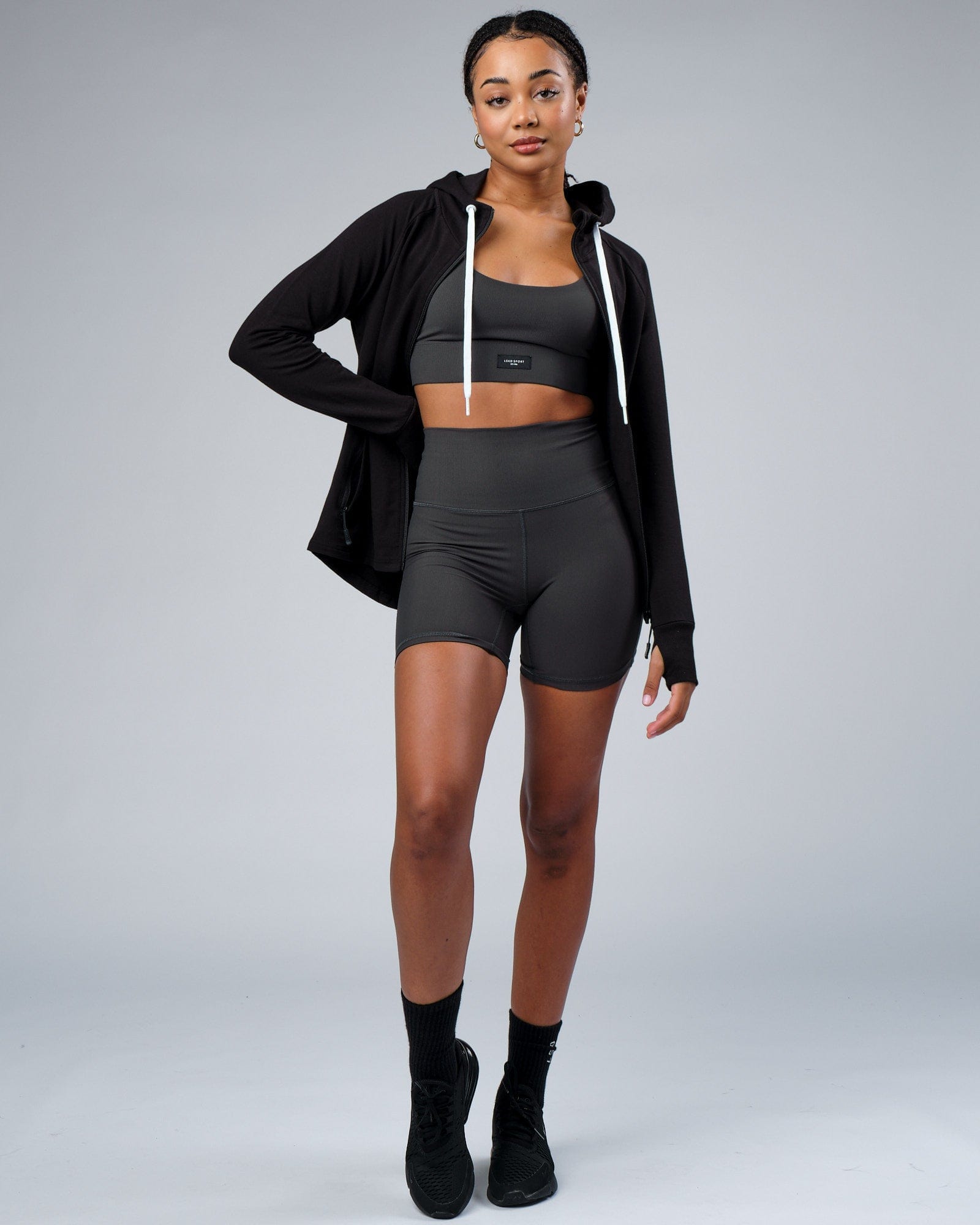 Model wearing Reserves Ribbed Mid Short Tight - Pirate Black