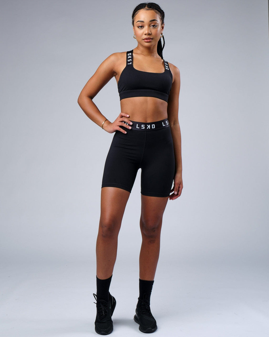 Model wearing Competition Mid Short Tight - Black White