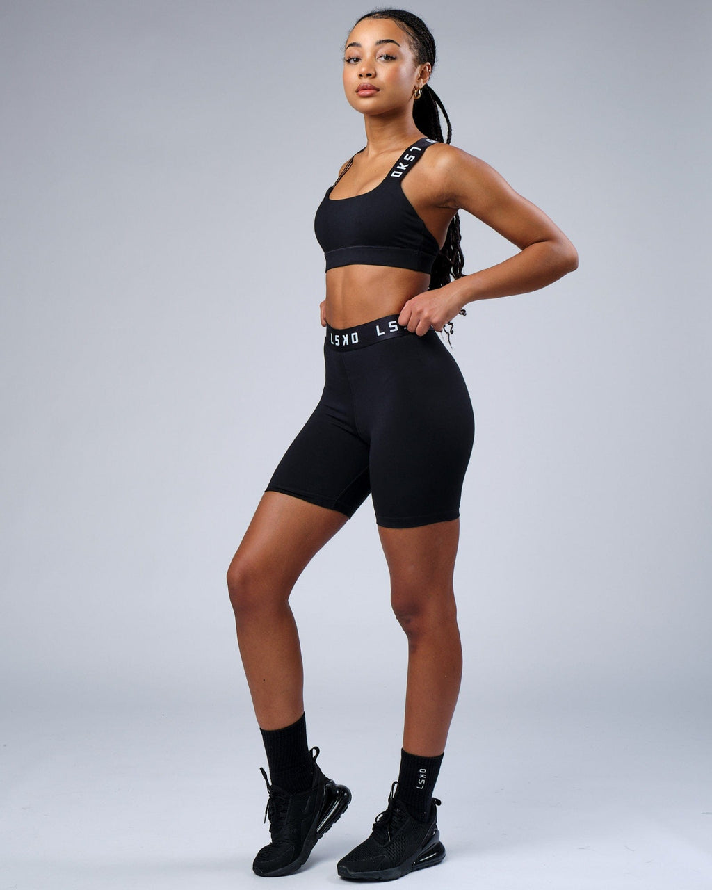 Model wearing Competition Mid Short Tight - Black White