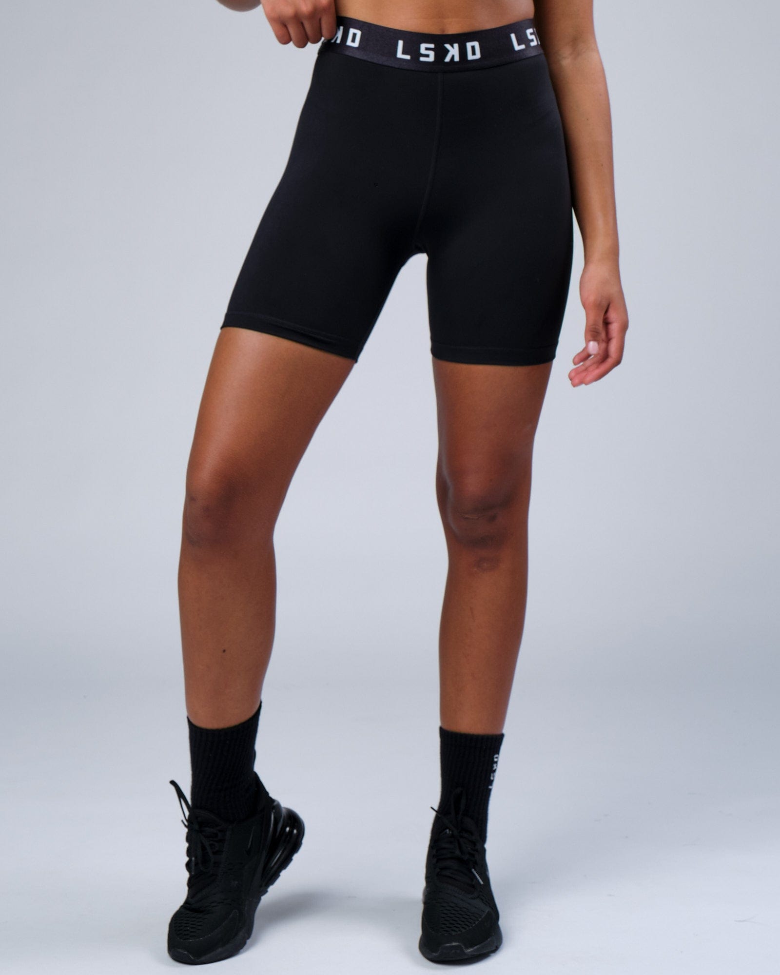 Model wearing Competition Mid Short Tight - Black White