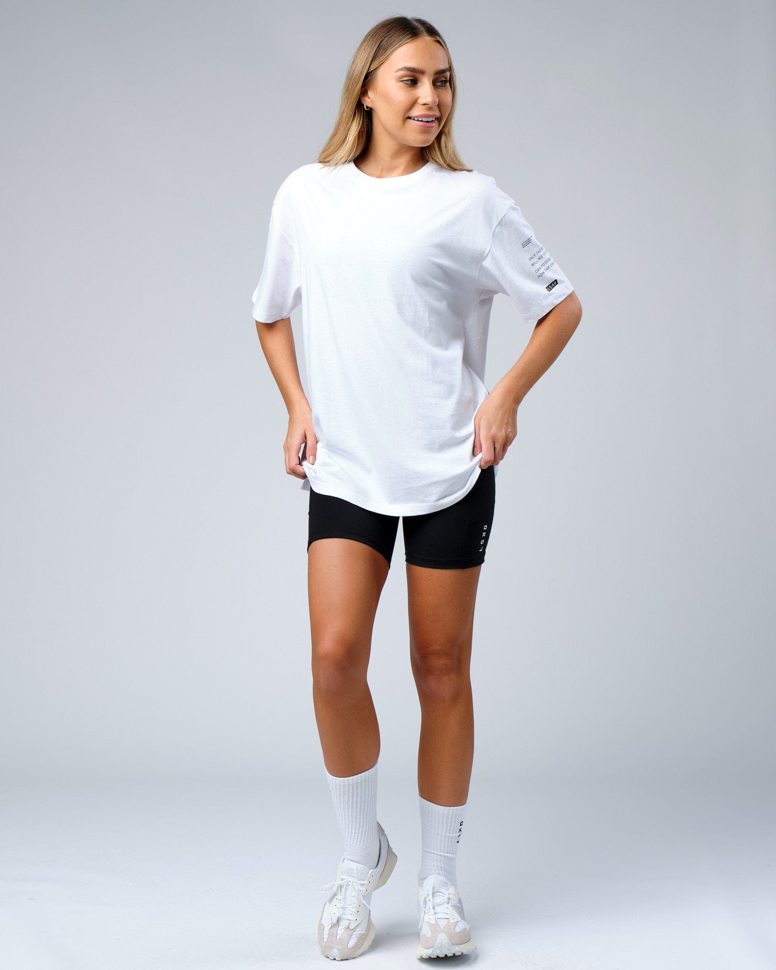 Model wearing Unisex Effort Tee Oversize - White