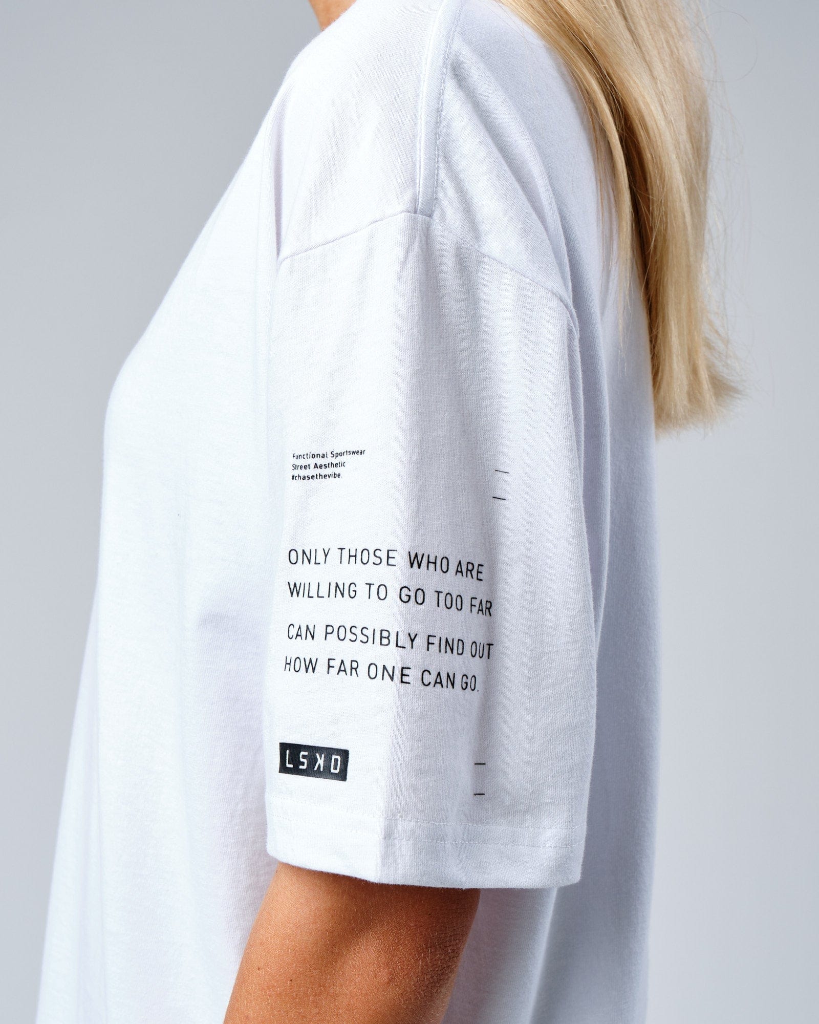 Model wearing Unisex Effort Tee Oversize - White