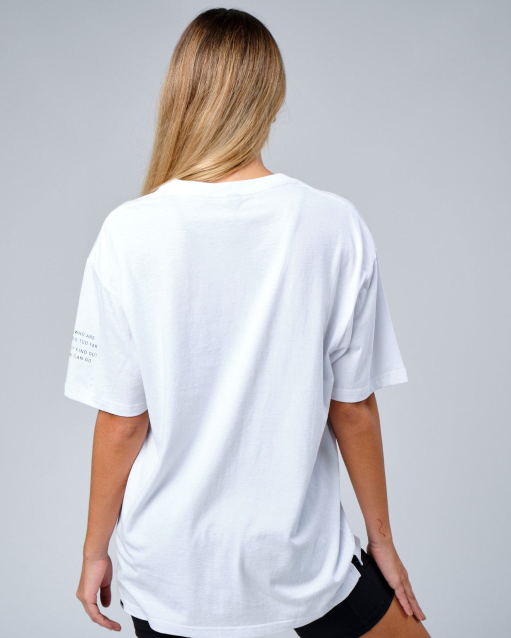 Model wearing Unisex Effort Tee Oversize - White
