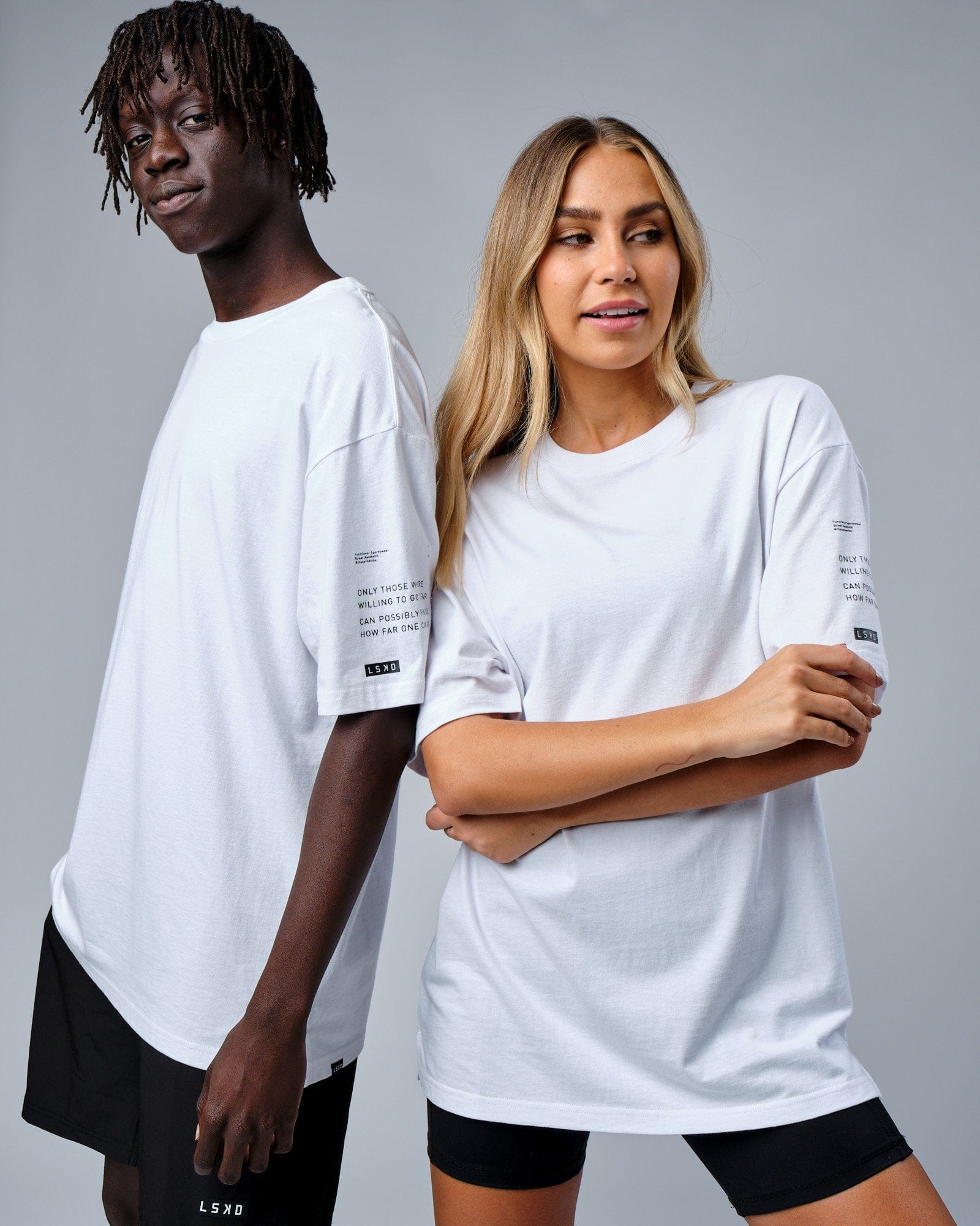 Model wearing Unisex Effort Tee Oversize - White