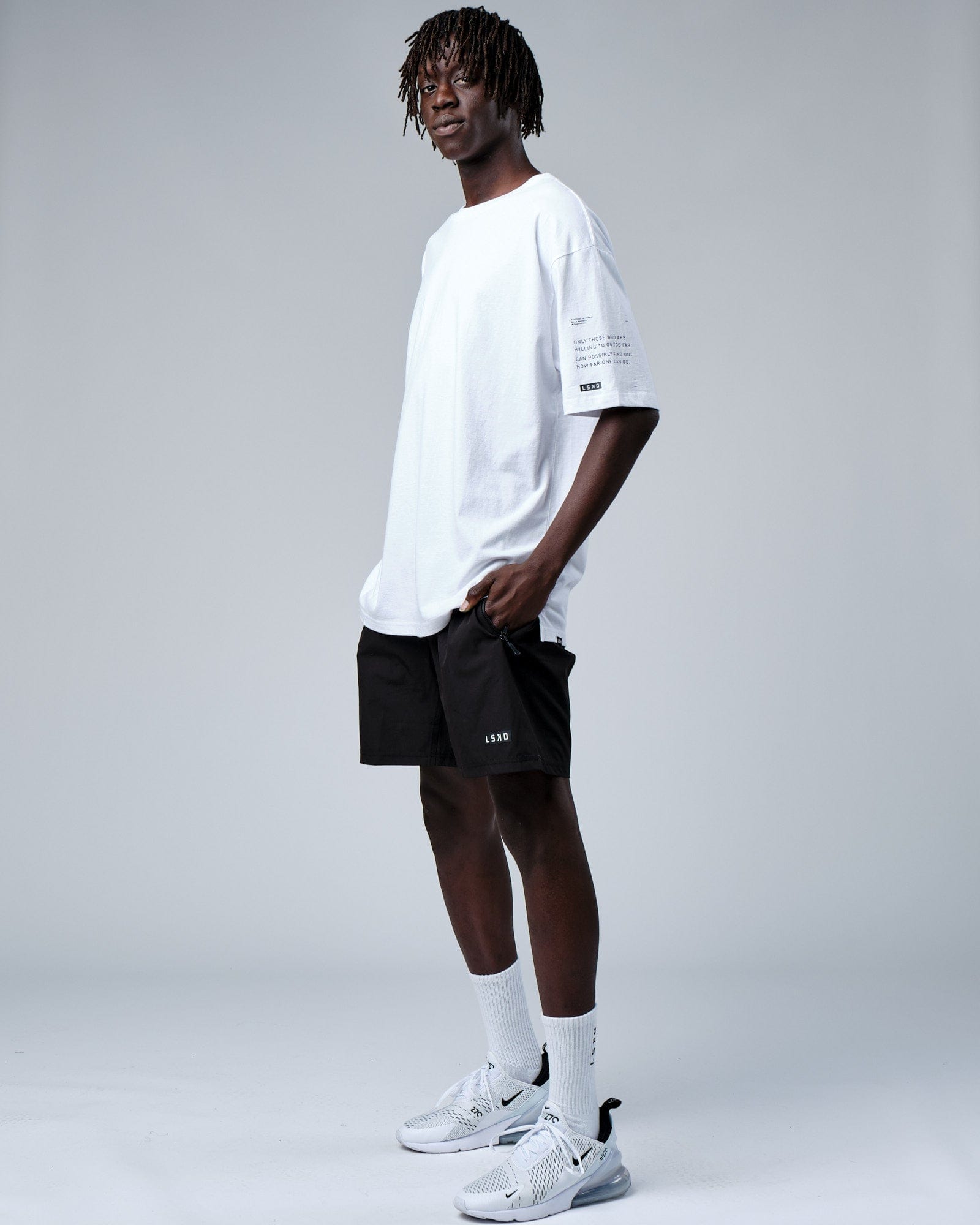 Model wearing Effort Tee Oversize - White
