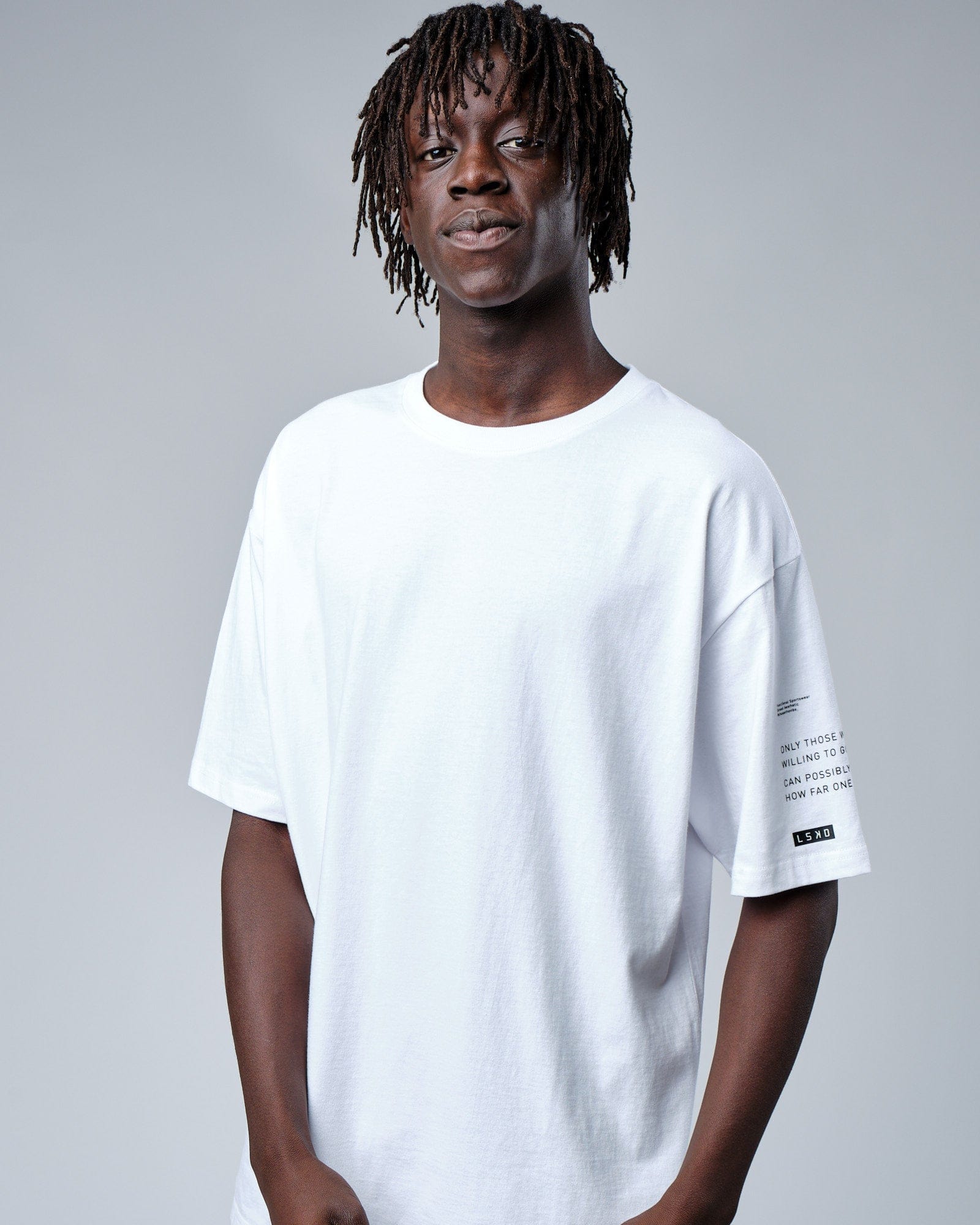 Model wearing Effort Tee Oversize - White