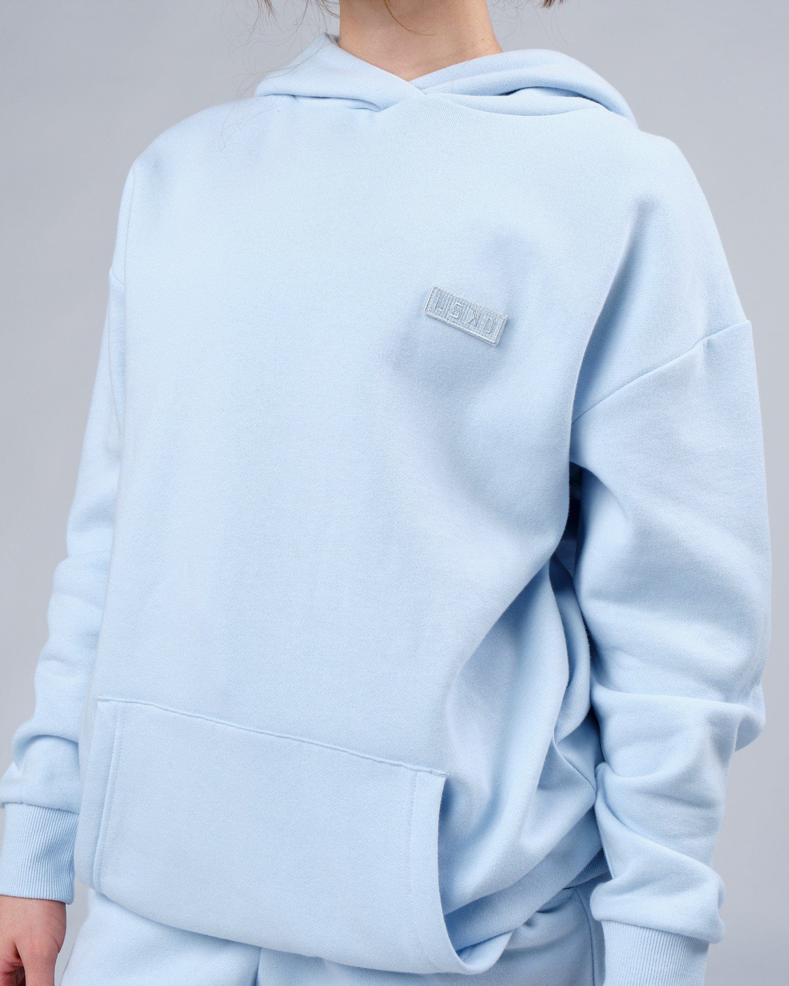 Model wearing Unisex Depth Hoodie Oversize - Sky Blue