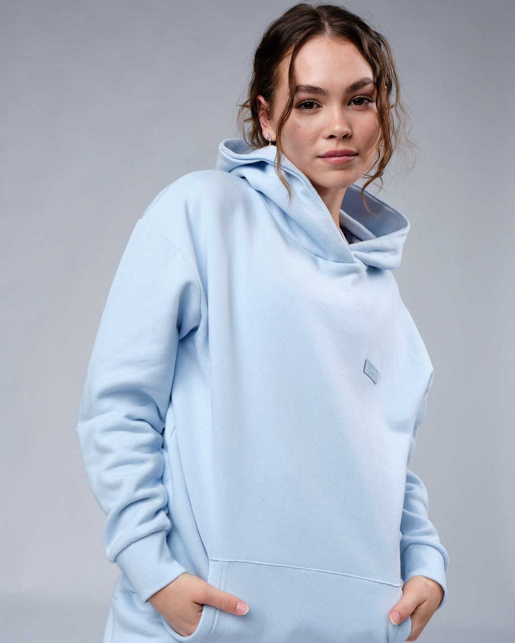 Model wearing Unisex Depth Hoodie Oversize - Sky Blue