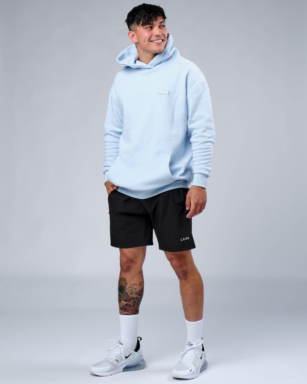 Model wearing Depth Hoodie Oversize - Sky Blue