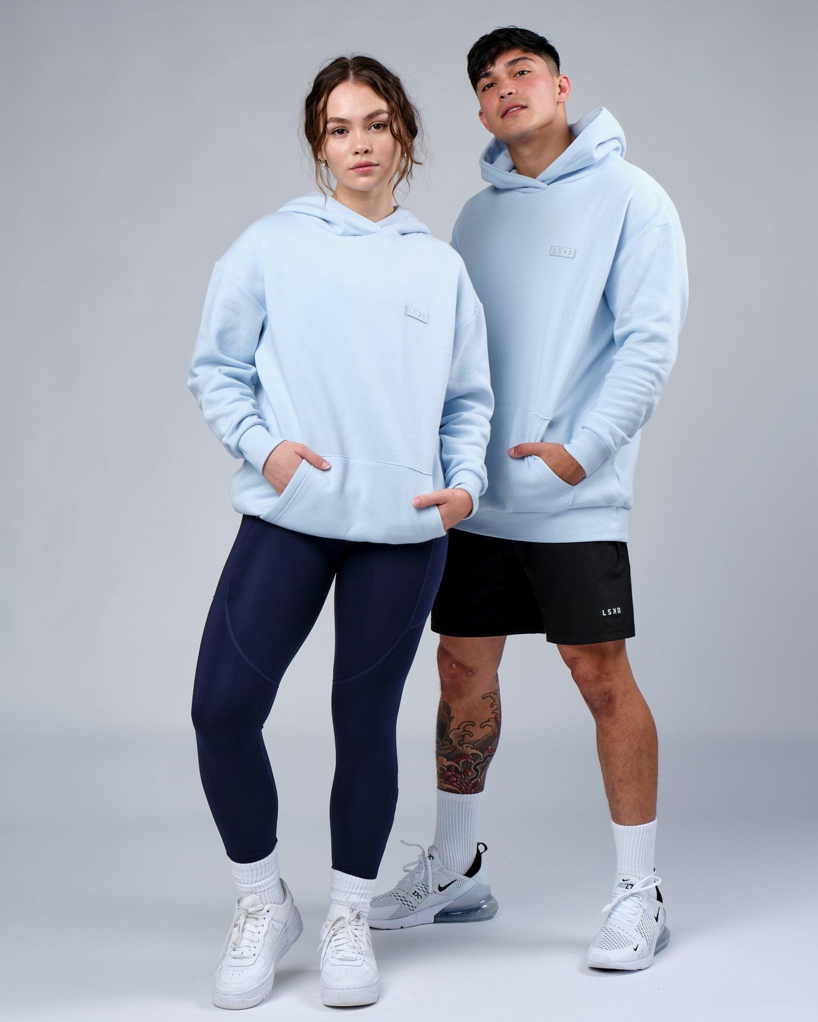 Model wearing Unisex Depth Hoodie Oversize - Sky Blue