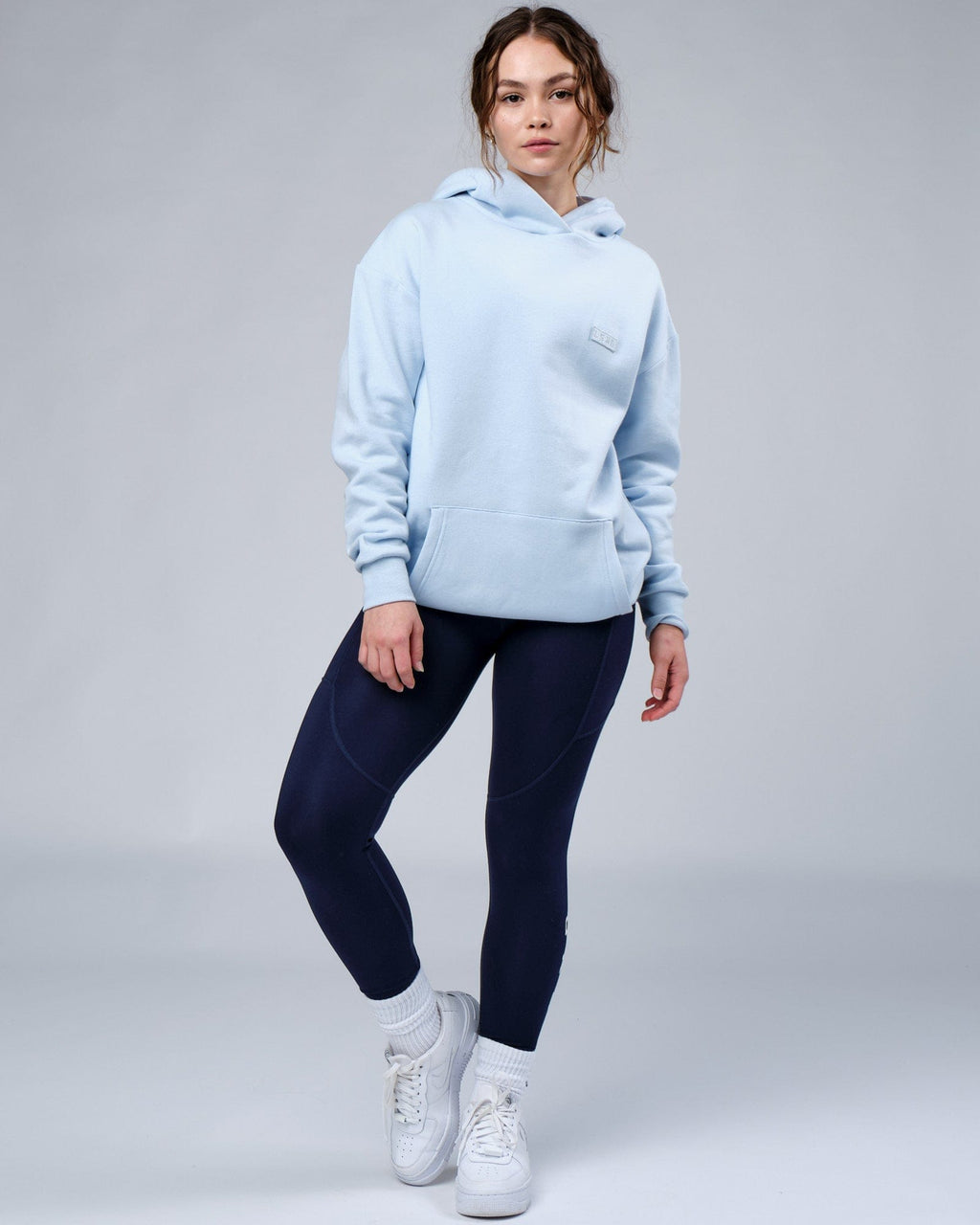Model wearing Unisex Depth Hoodie Oversize - Sky Blue