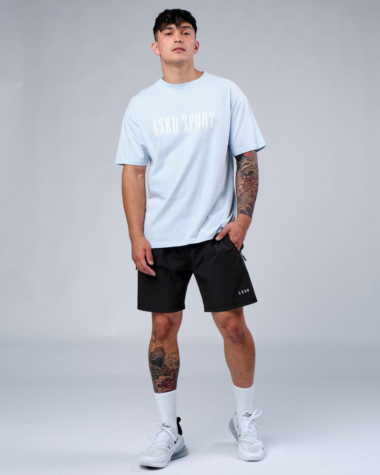 Model wearing Faculty Tee Vintage Fit - Sky Blue