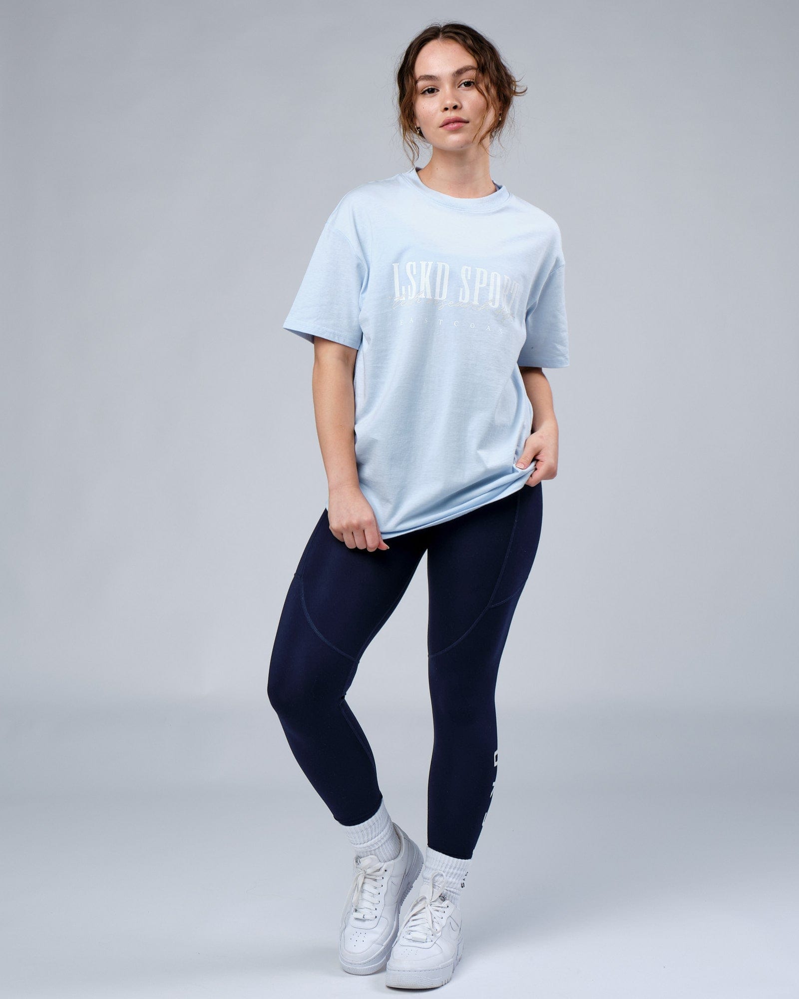 Model wearing Unisex Faculty Tee Vintage Fit Oversize - Sky Blue