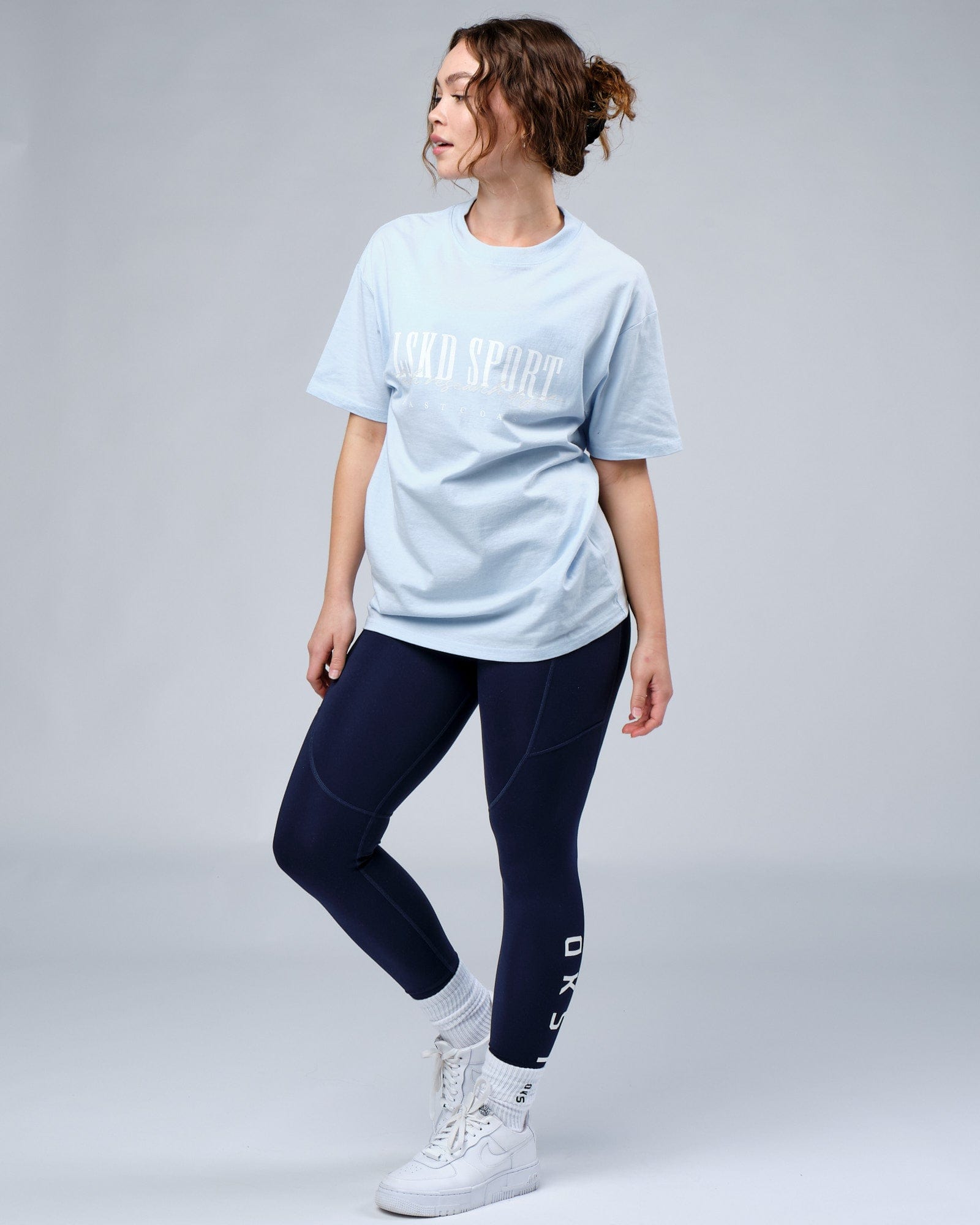 Model wearing Unisex Faculty Tee Vintage Fit Oversize - Sky Blue