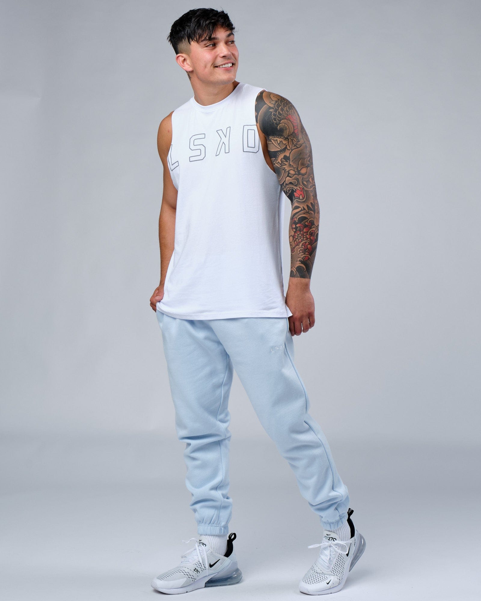 Model wearing Expand FLXCotton Training Fit Tank - White
