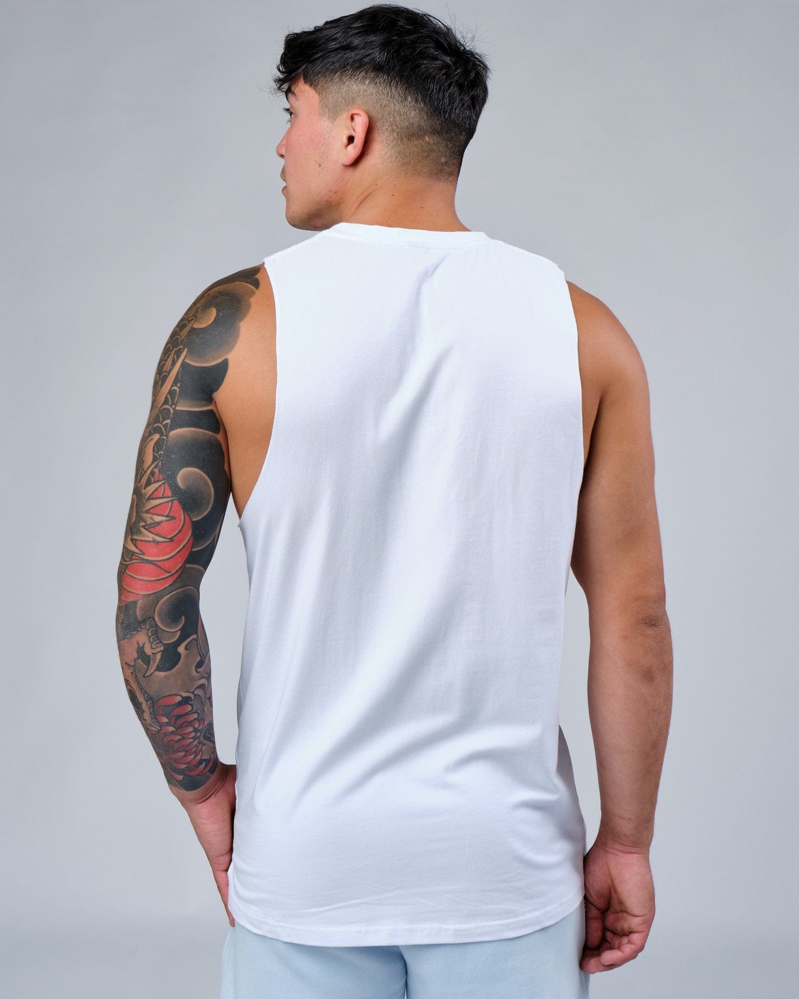 Model wearing Expand FLXCotton Training Fit Tank - White