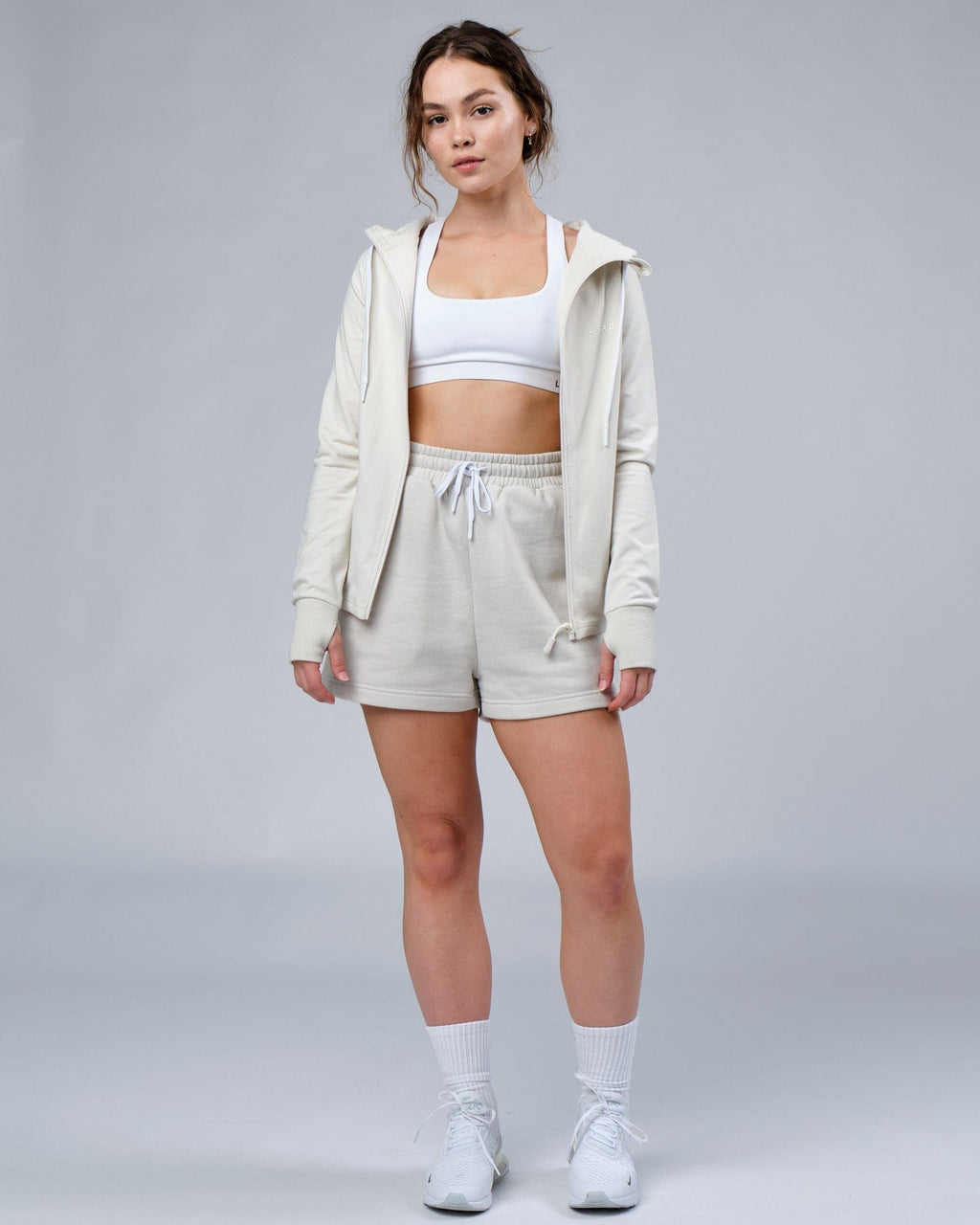 Model wearing Ready Track Short - Bone