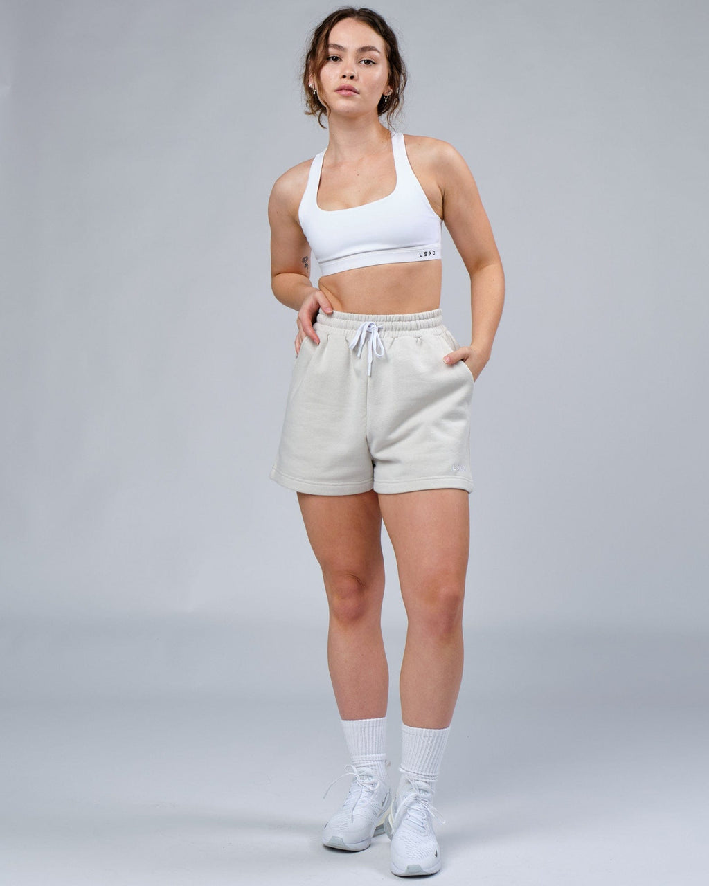 Model wearing Ready Track Short - Bone