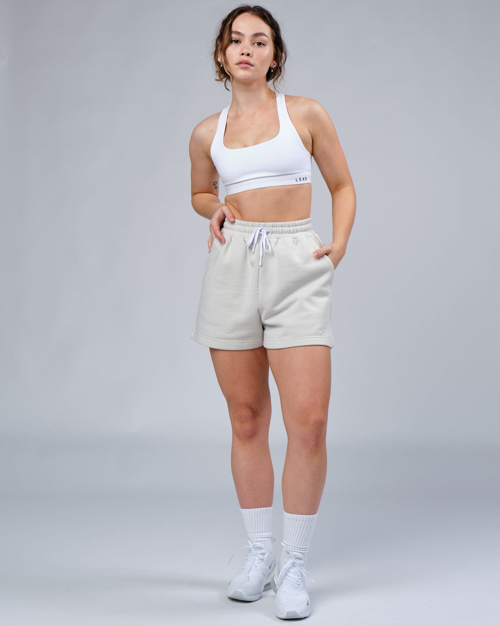 Model wearing Ready Track Short - Bone