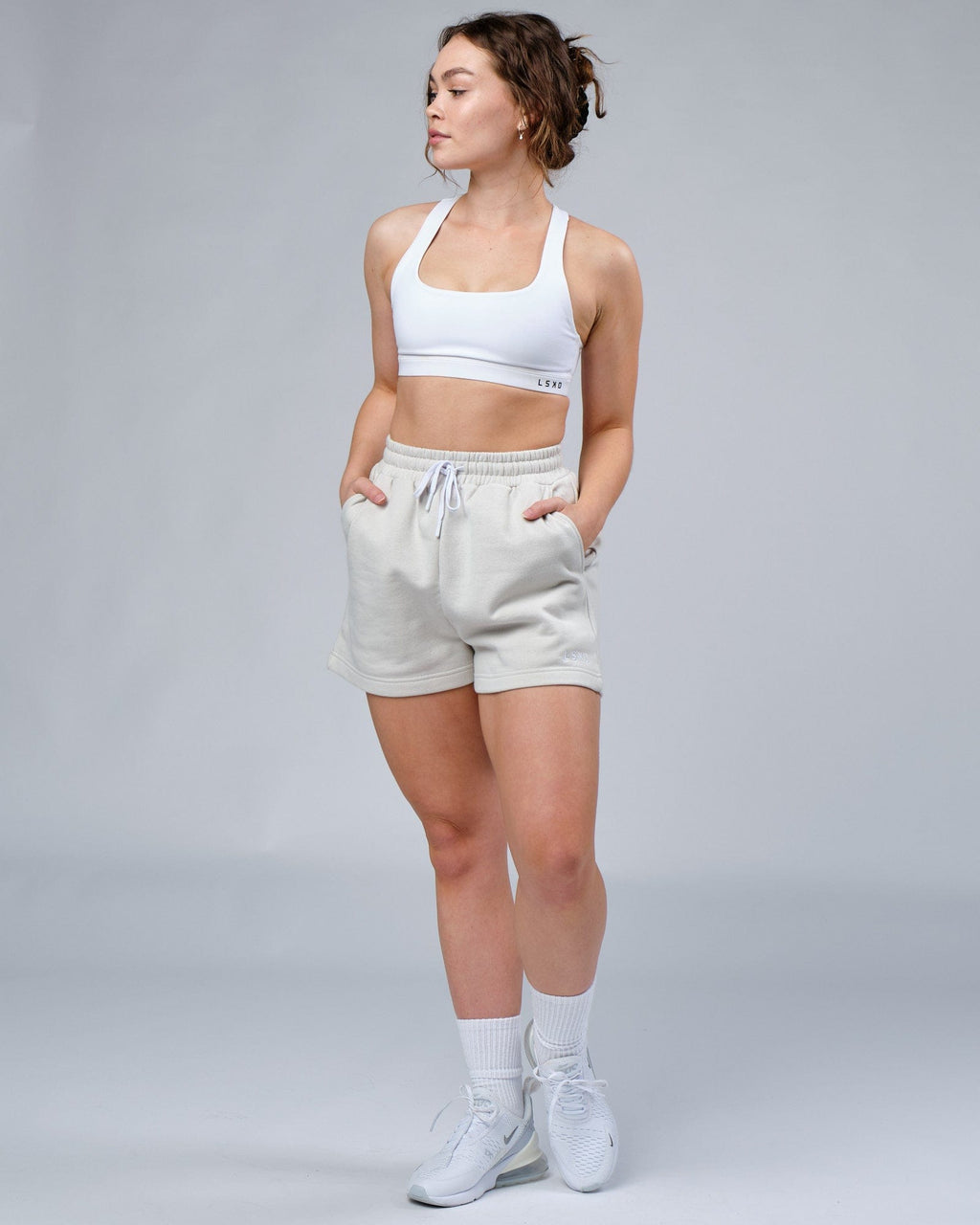 Model wearing Ready Track Short - Bone