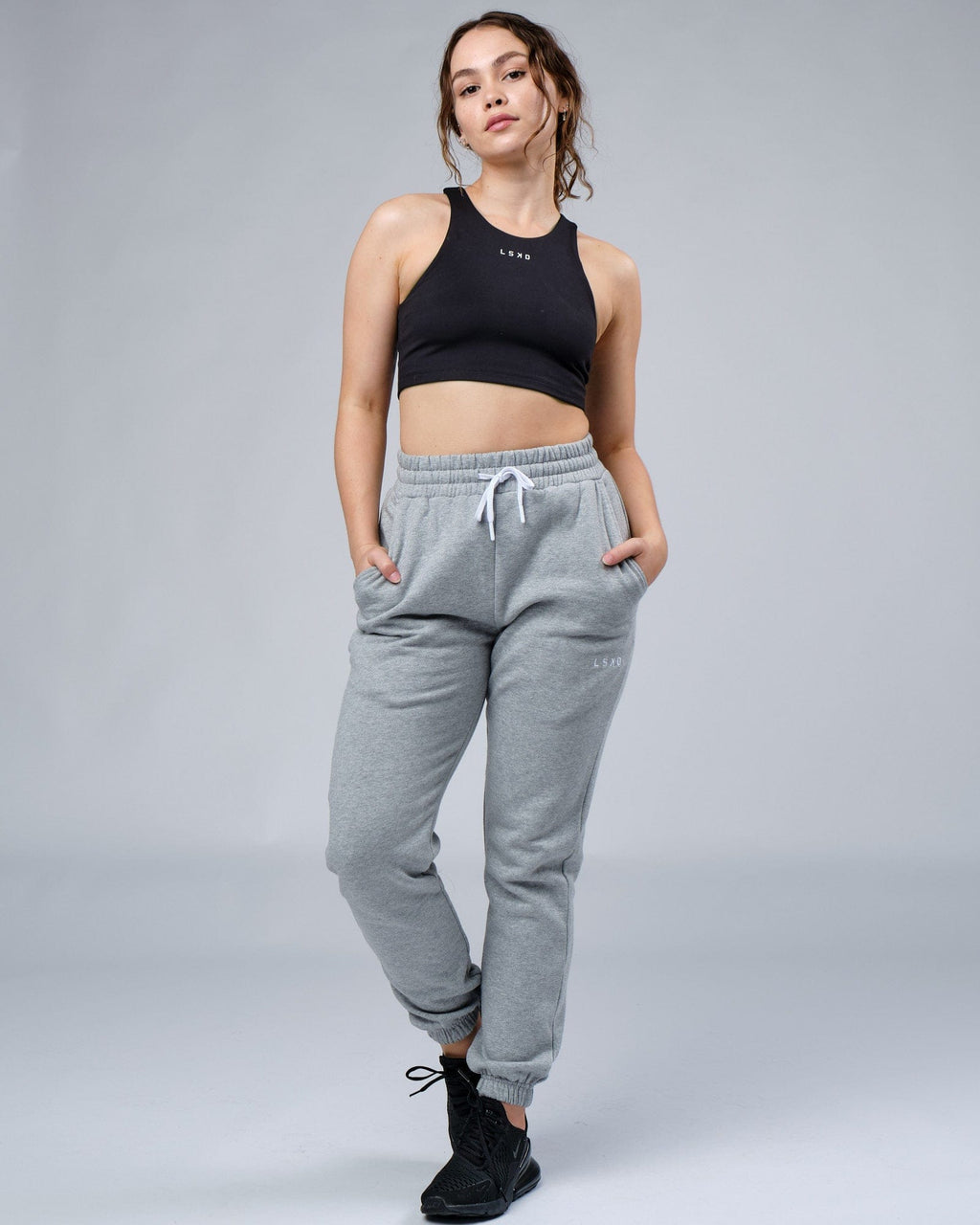 Model wearing Unisex Ready Track Pant - Lt Grey Marl