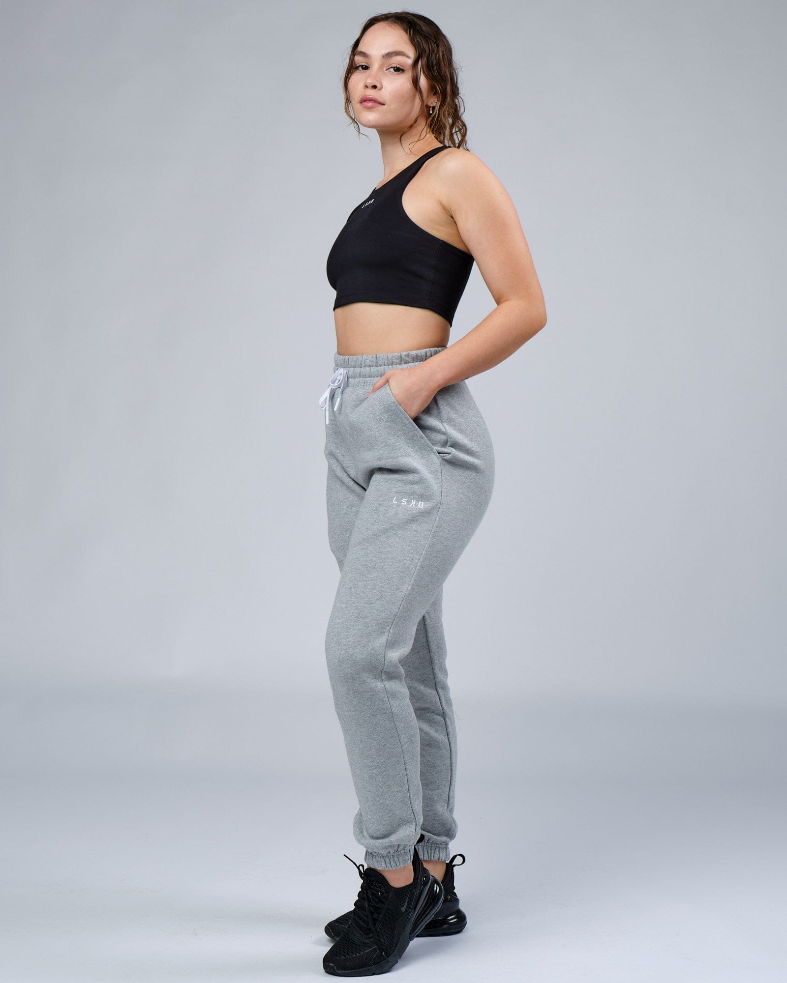 Model wearing Unisex Ready Track Pant - Lt Grey Marl