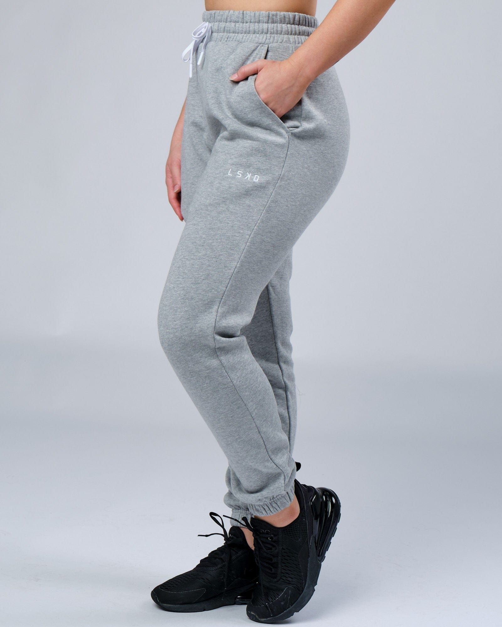 Model wearing Unisex Ready Track Pant - Lt Grey Marl