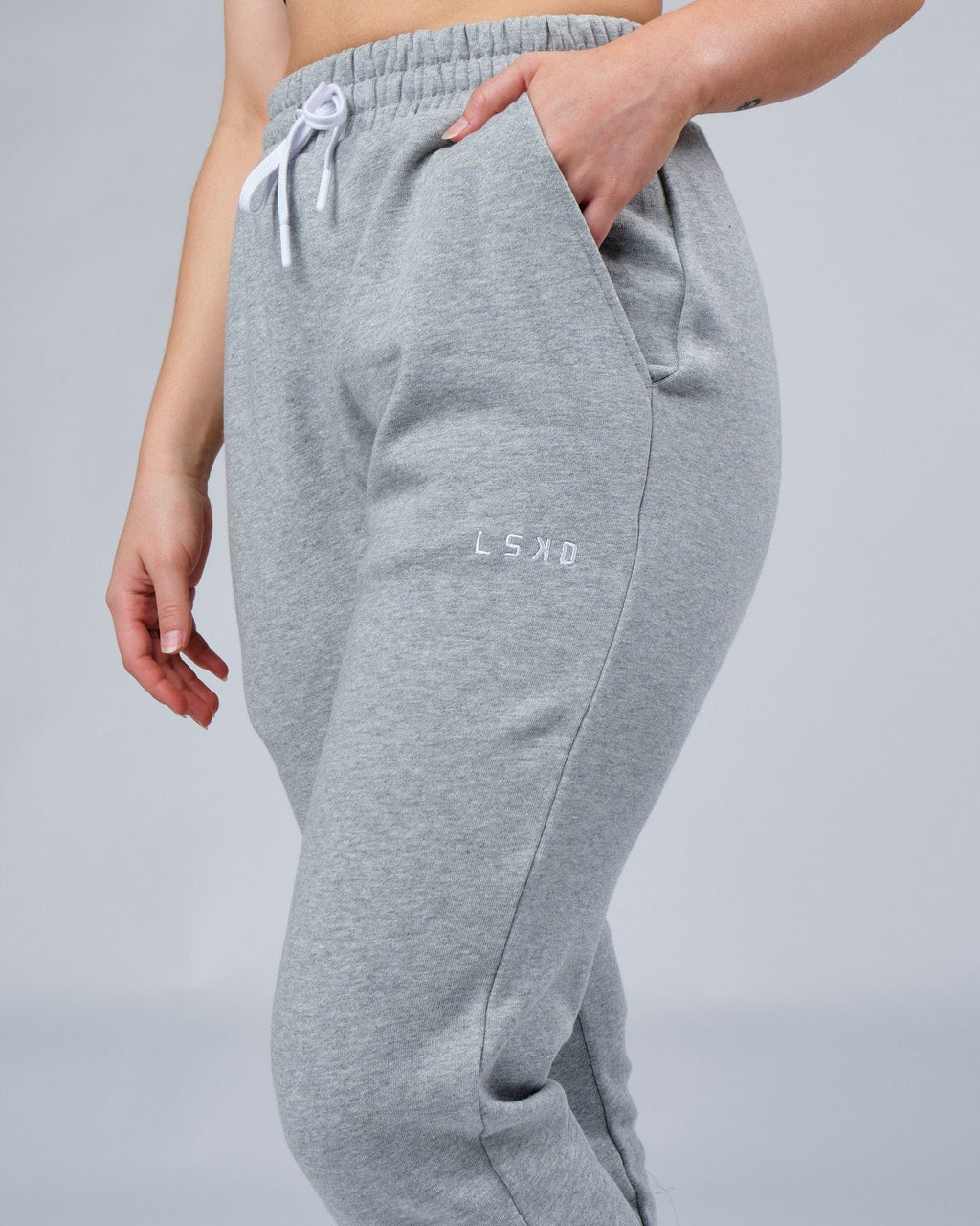 Model wearing Unisex Ready Track Pant - Lt Grey Marl