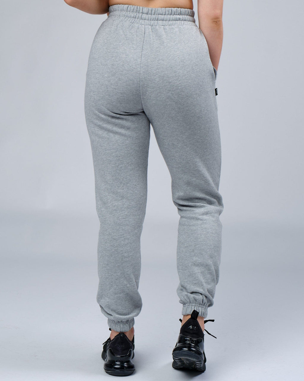 Model wearing Unisex Ready Track Pant - Lt Grey Marl