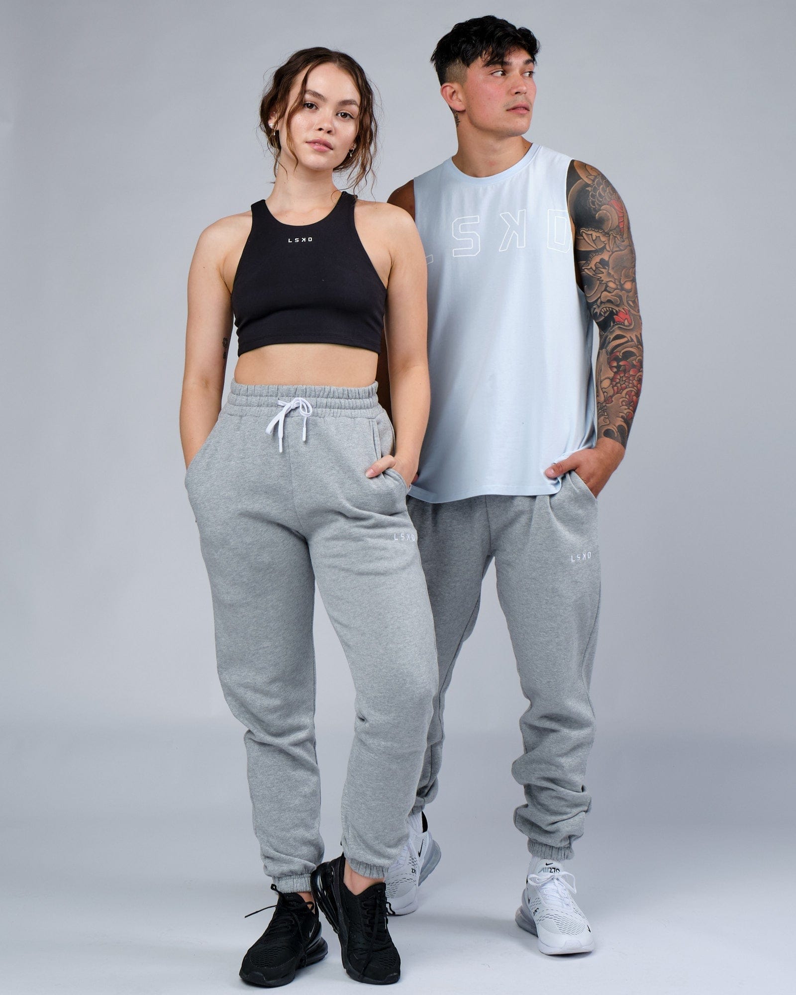Model wearing Unisex Ready Track Pant - Lt Grey Marl