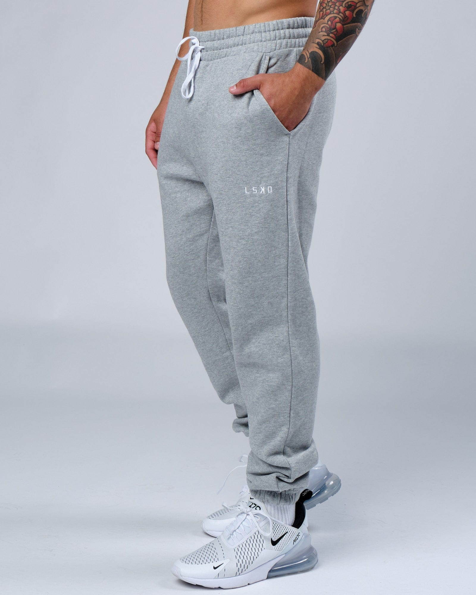 Model wearing Ready Track Pant - Lt Grey Marl
